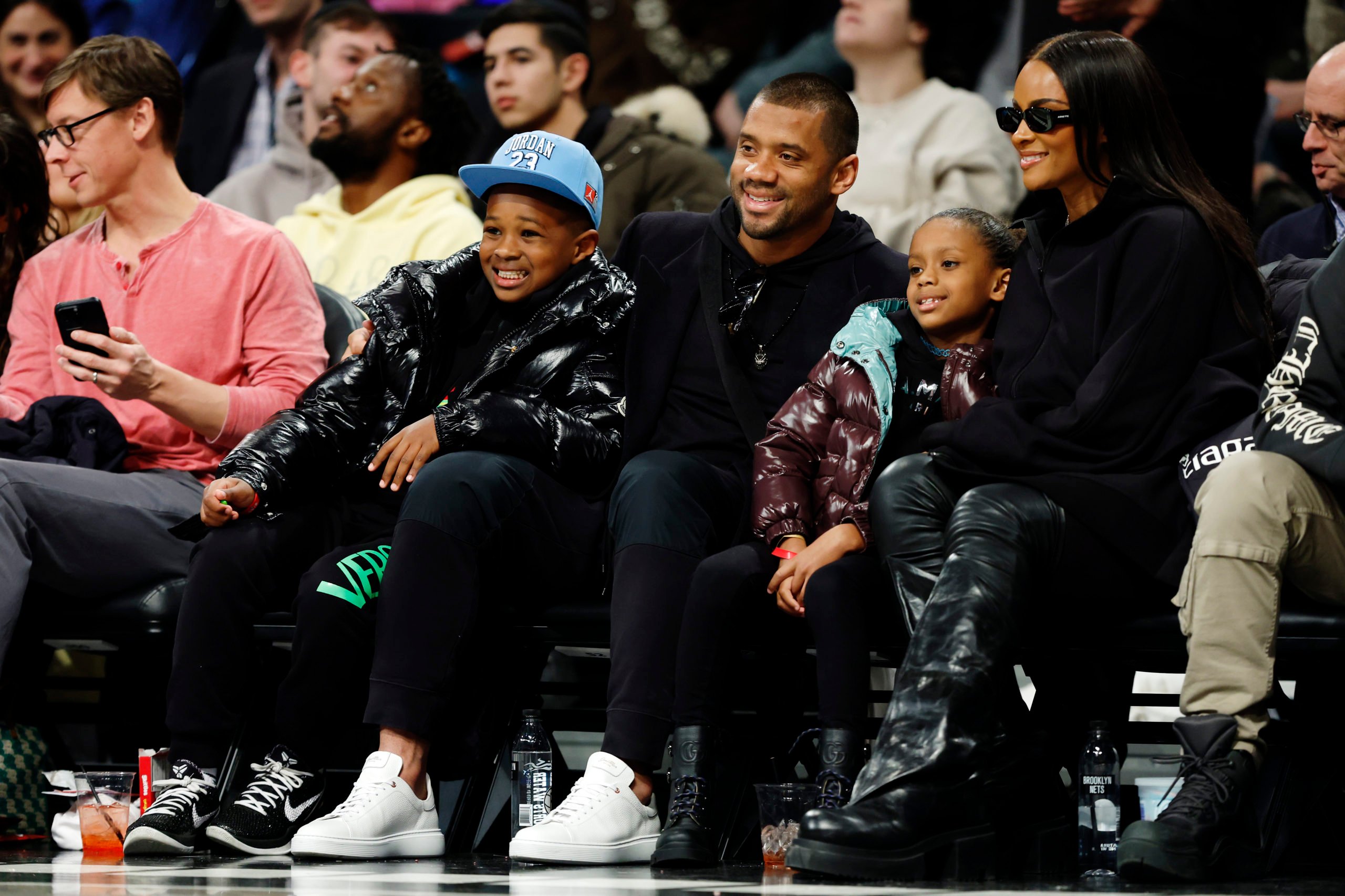 NEW YORK, NEW YORK - FEBRUARY 13: (L-R) Future Zahir Wilburn, American football quarterback Russell Wilson, Sienna Princess Wilson, and singer Ciara attend the game between the Brooklyn Nets and the Boston Celtics at Barclays Center on February 13, 2024 in the Brooklyn borough of New York City. Sarah Stier/Getty Images