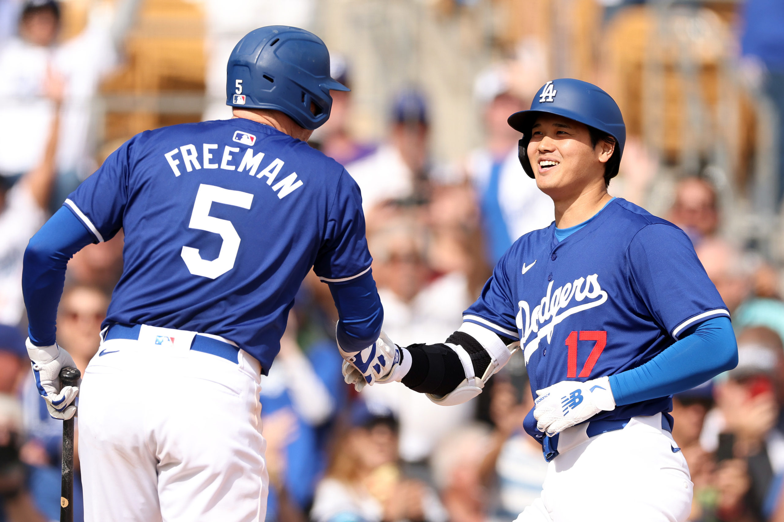 GLENDALE, ARIZONA - FEBRUARY 27: Shohei Ohtani #17 celebrates with Freddie Freeman #5 of the Los Angeles Dodgers after hitting a two-run home run in the fifth inning inning during a game against the Chicago White Sox at Camelback Ranch on February 27, 2024 in Glendale, Arizona. Christian Petersen/Getty Images
