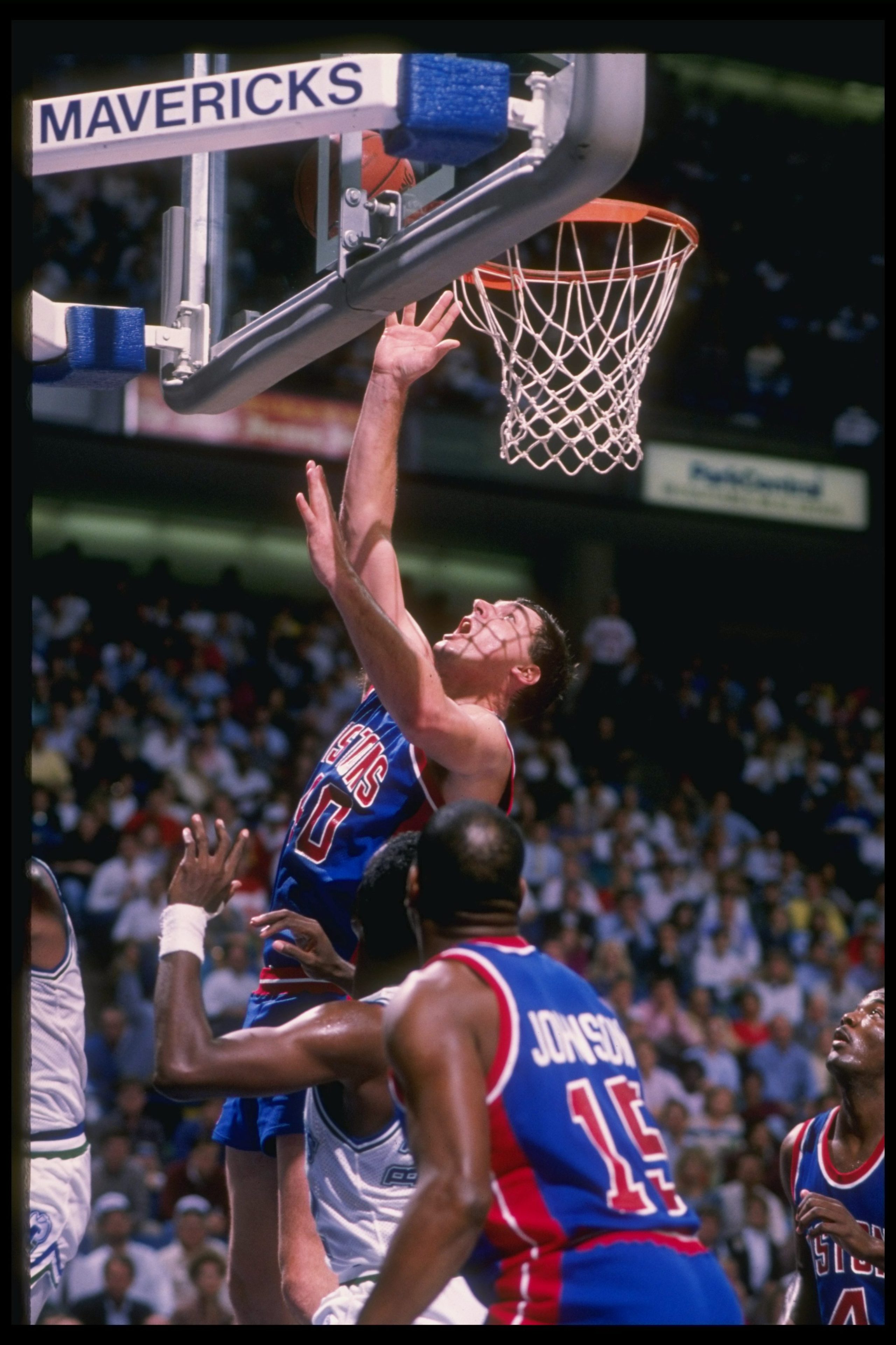 1990: Center Bill Laimbeer of the Detroit Pistons goes up for two during a game against the Dallas Mavericks. Joe Patronite /Allsport