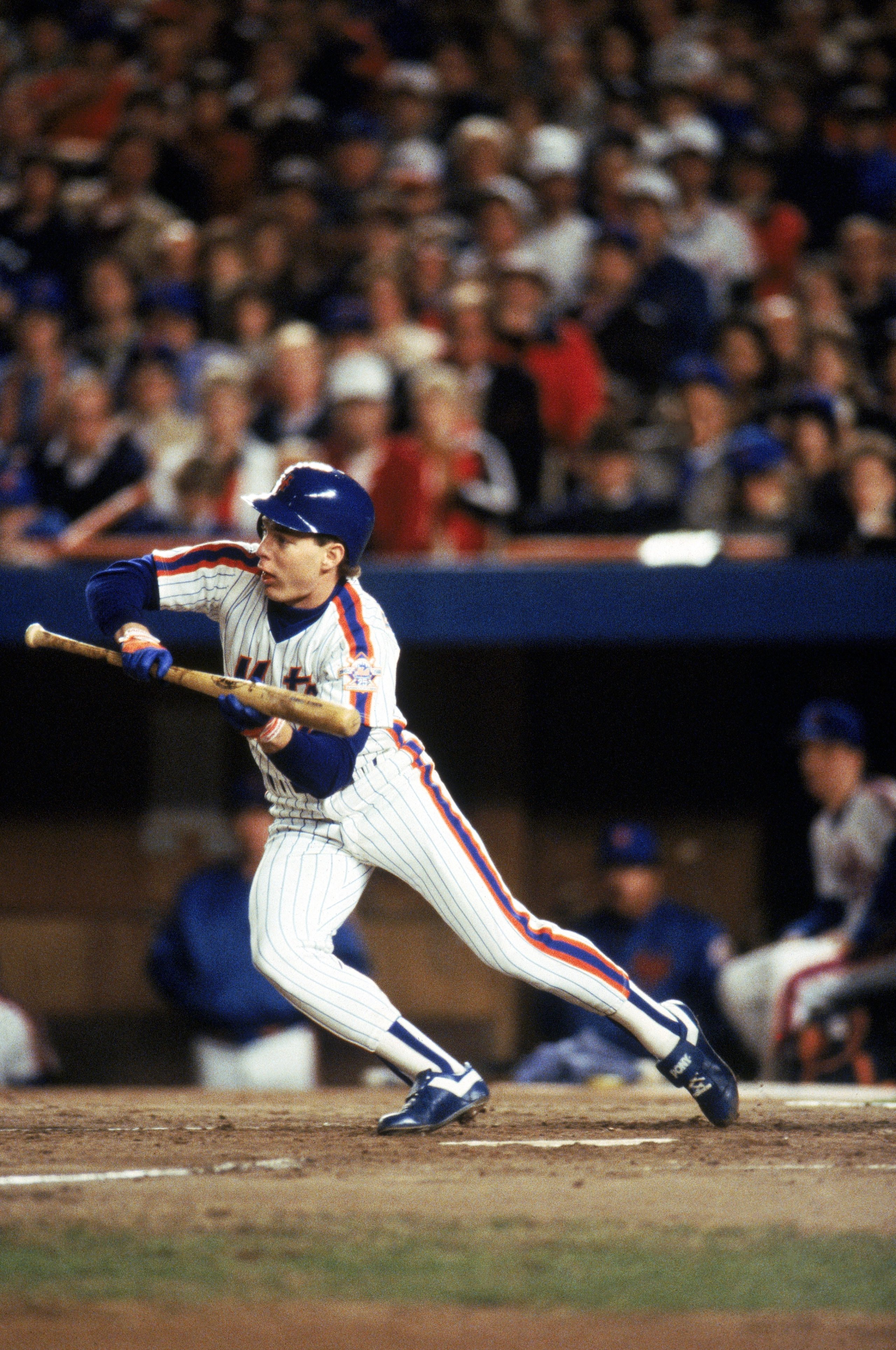 FLUSHING, NY - OCTOBER 27: Outfielder Lenny Dykstra #4 of the New York Mets bunts during game 7 of the 1986 World Series against the Boston Red Sox at Shea Stadium on October 27, 1986 in Flushing, New York. The Mets won the series 4-3. T.G. Higgins/Getty Images