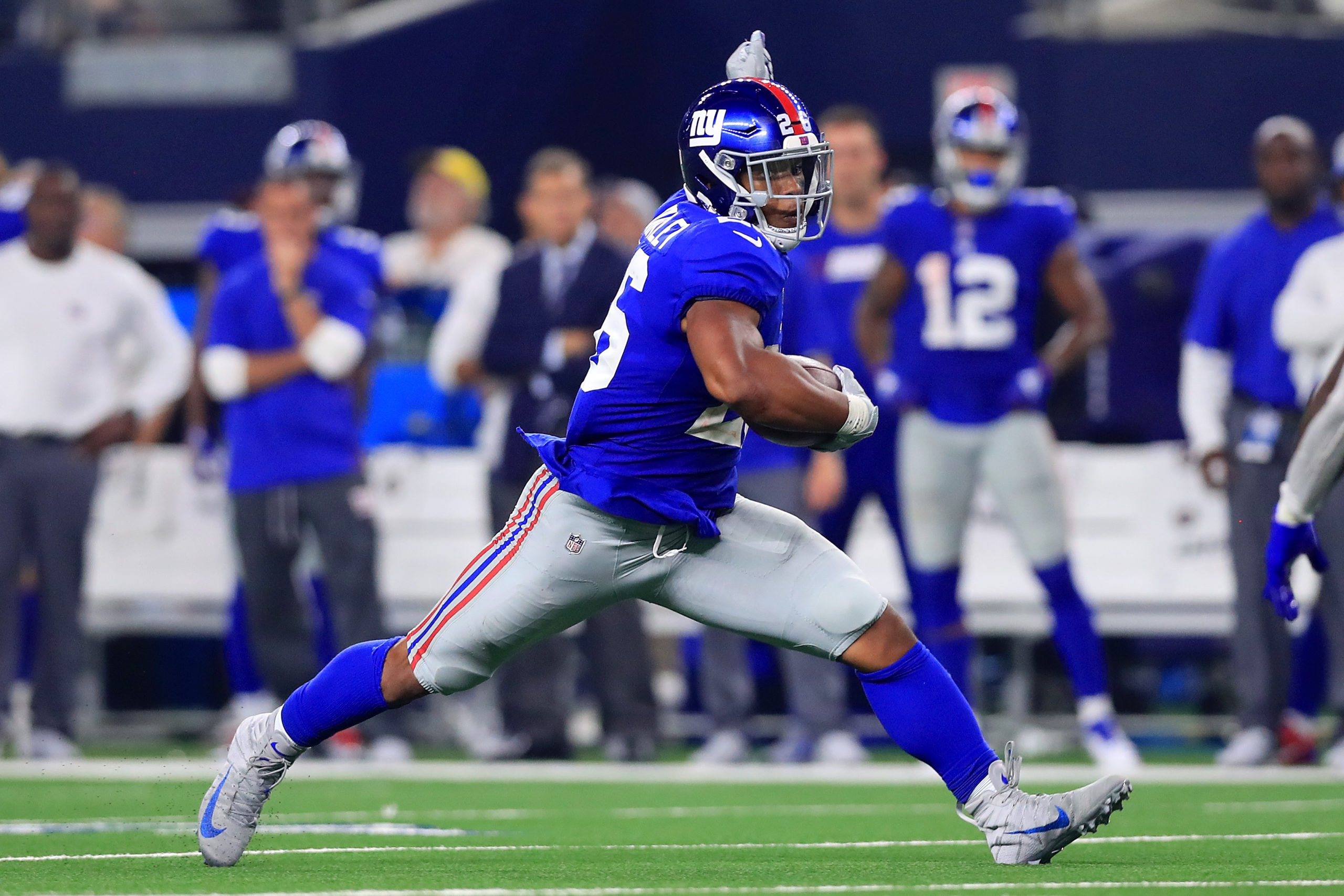 ARLINGTON, TX - SEPTEMBER 16: Saquon Barkley #26 of the New York Giants carries the ball against the Dallas Cowboys in the fourth quarter at AT&T Stadium on September 16, 2018 in Arlington, Texas. Tom Pennington/Getty Images