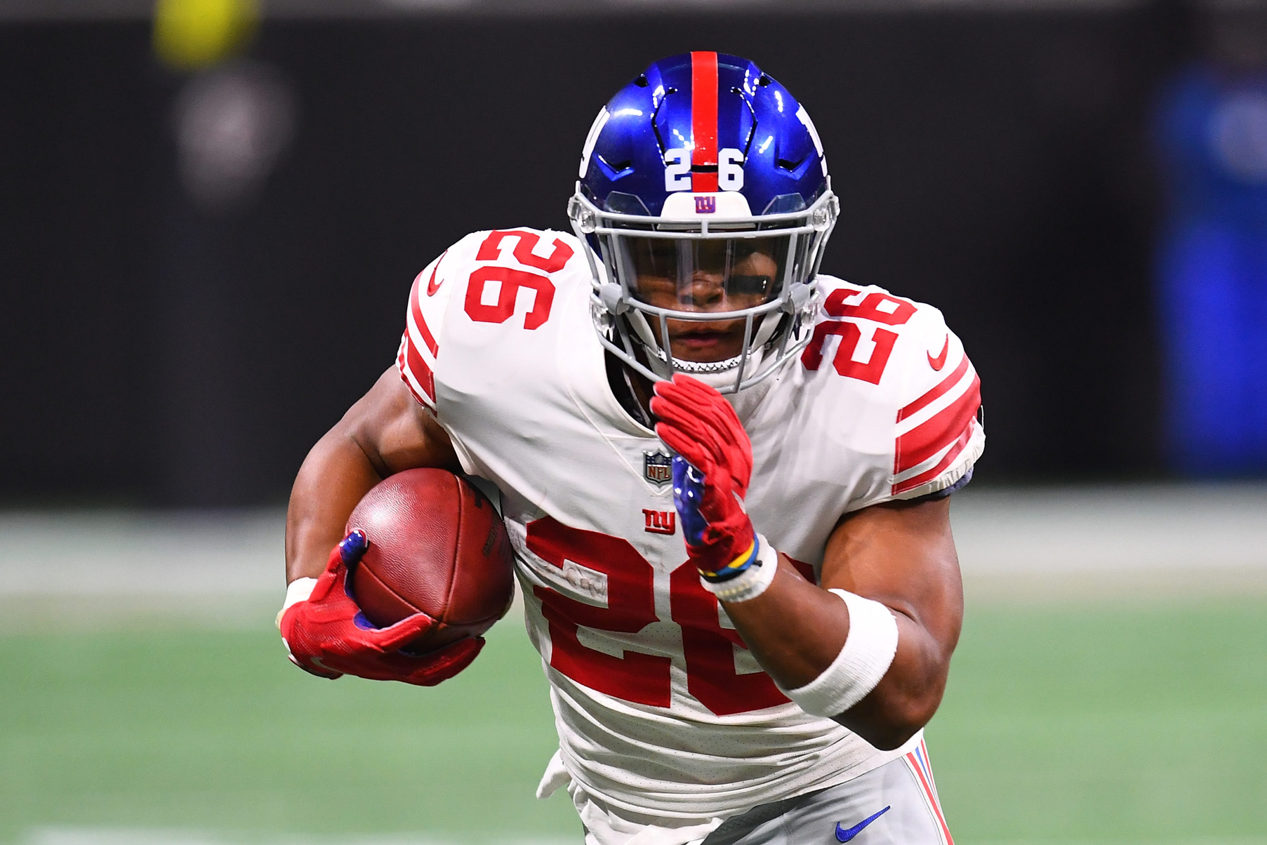 ATLANTA, GA - OCTOBER 22: Saquon Barkley #26 of the New York Giants runs the ball during the second quarter against the New York Giants at Mercedes-Benz Stadium on October 22, 2018 in Atlanta, Georgia. Scott Cunningham/Getty Images