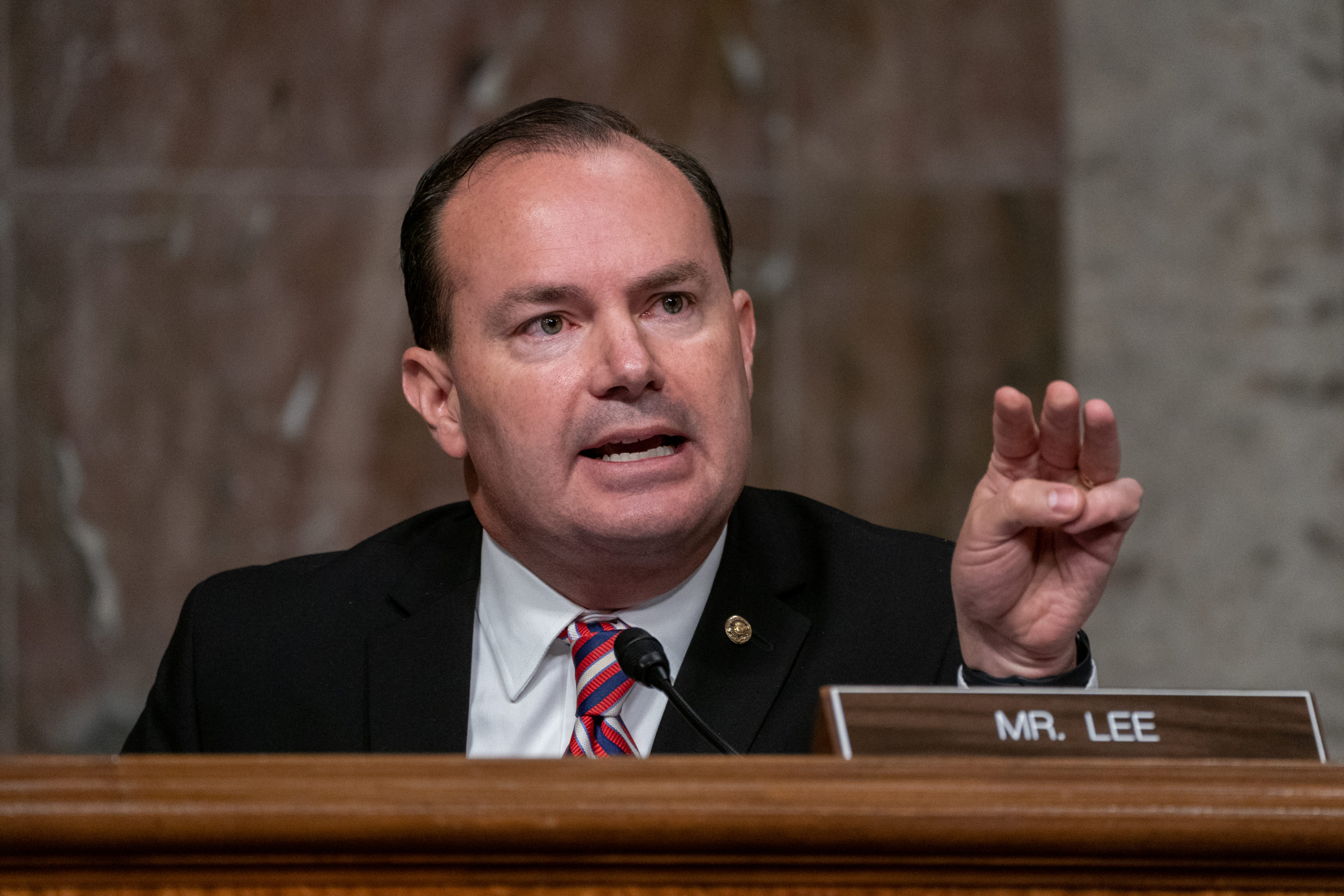 WASHINGTON, DC - SEPTEMBER 30: U.S. Sen. Mike Lee (R-UT) asks a question of former FBI Director James Comey at a hearing of the Senate Judiciary Committee on September 30, 2020 in Washington, DC. Comey was testifying in the committee's probe into the origins of the investigation into Russian interference in the 2016 election. (Photo by Ken Cedeno-Pool/Getty Images)