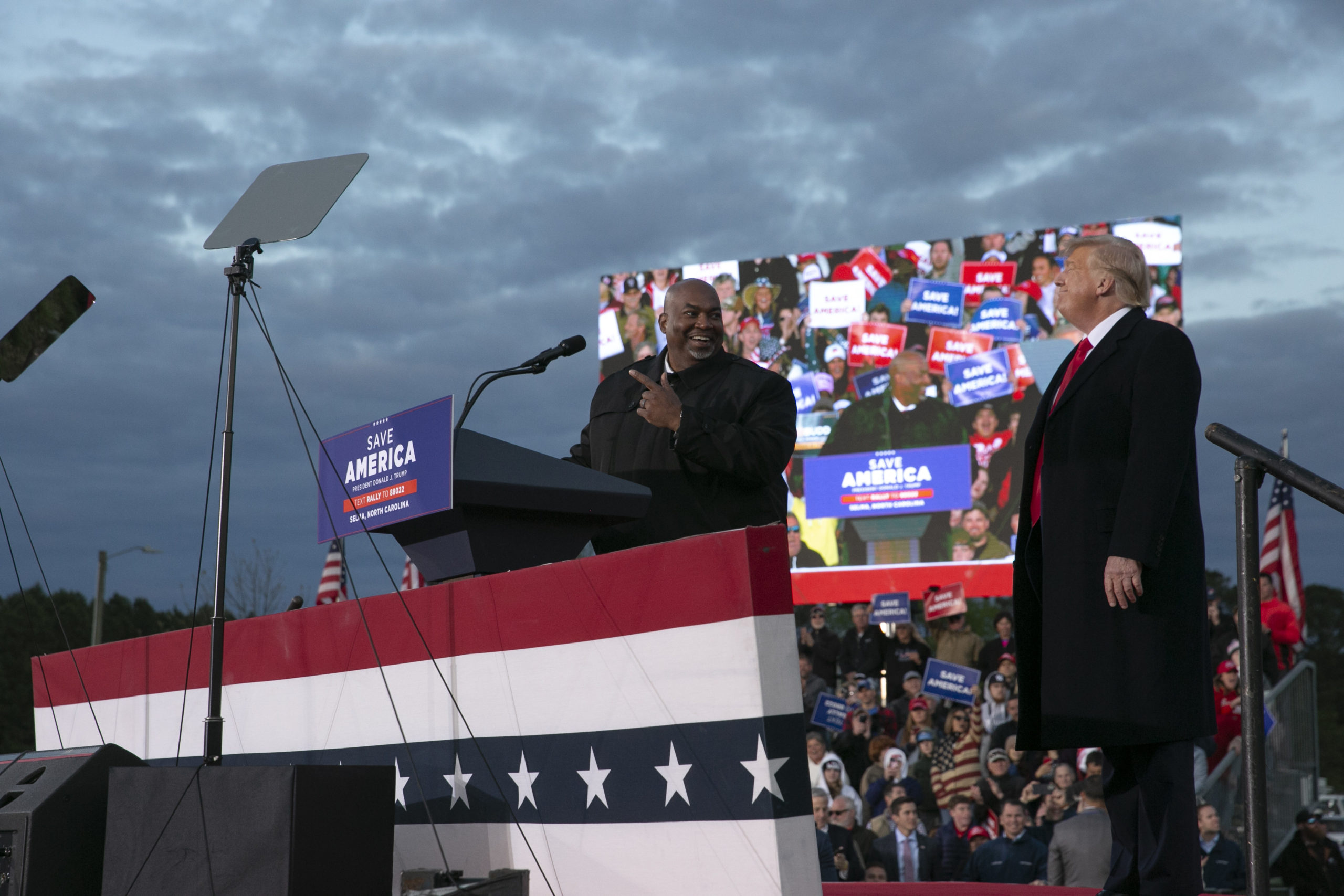 SELMA, NC - APRIL 09: Lt. Gov. Mark Robinson joins the stage with former U.S. President Donald Trump during a rally at The Farm at 95 on April 9, 2022 in Selma, North Carolina. The rally comes about five weeks before North Carolinas primary elections where Trump has thrown his support behind candidates in some key Republican races. (Photo by Allison Joyce/Getty Images)