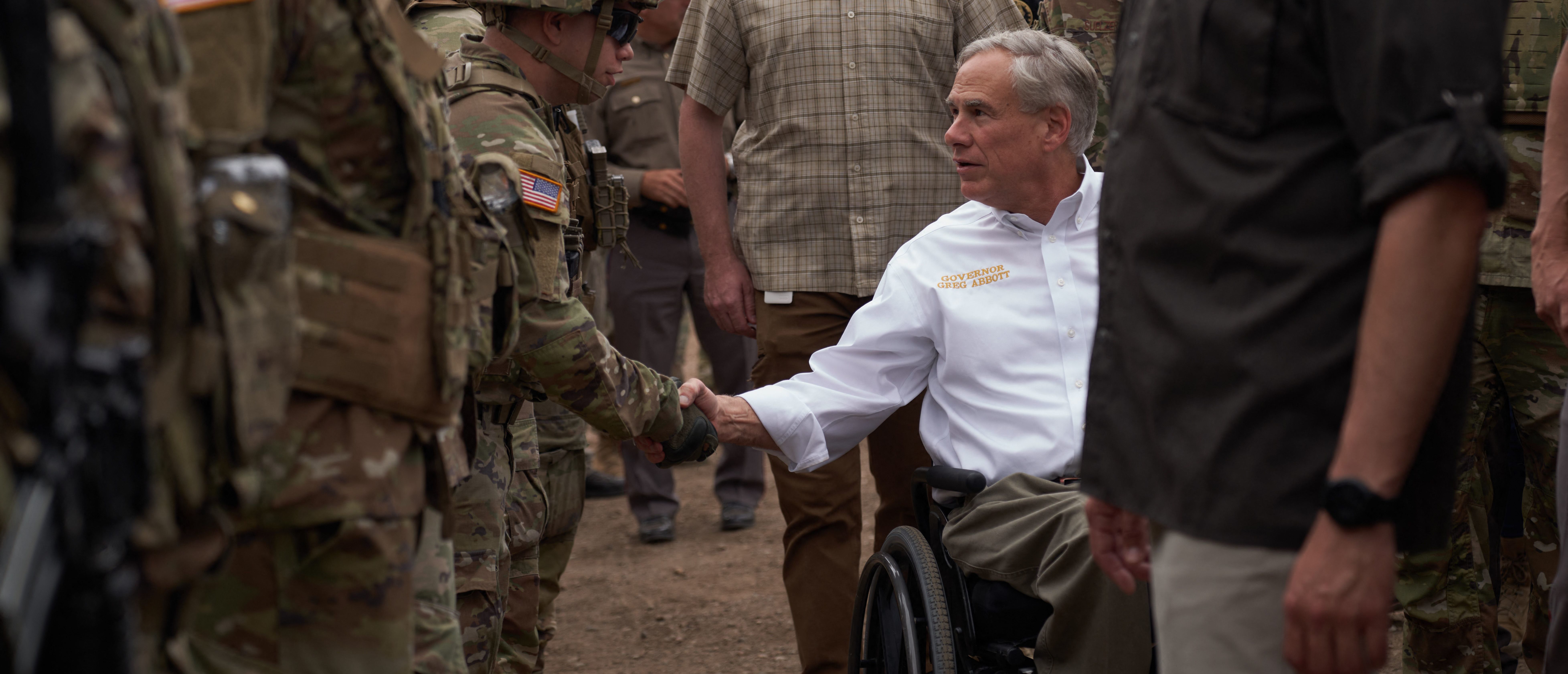 Texas Governor Greg Abbott tours the US-Mexico border at the Rio Grande River in Eagle Pass, Texas, on May 23, 2022. - A Louisiana federal judge blocked the Biden administration on Friday from ending Title 42, a pandemic-related border restriction that allows for the immediate expulsion of asylum-seekers and other migrants. (Photo by allison dinner / AFP) (Photo by ALLISON DINNER/AFP via Getty Images)