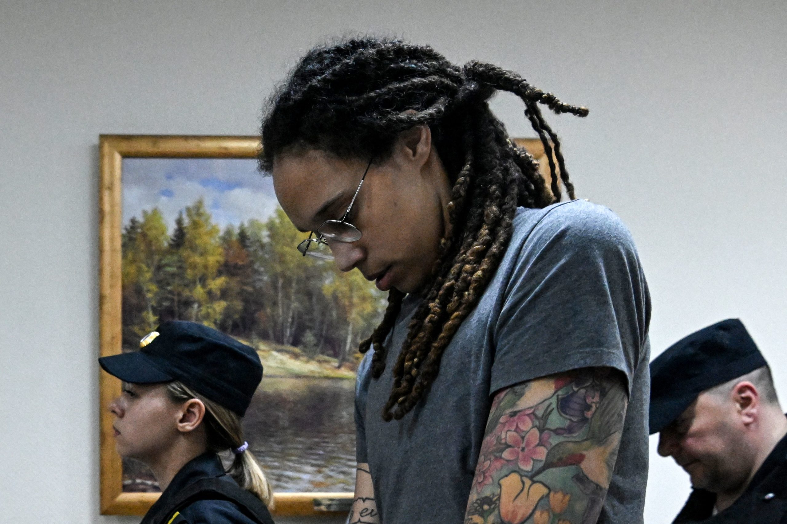 US Women's National Basketball Association (WNBA) basketball player Brittney Griner, who was detained at Moscow's Sheremetyevo airport and later charged with illegal possession of cannabis, leaves the courtroom after the court's verdict in Khimki outside Moscow, on August 4, 2022. - A Russian court found Griner guilty of smuggling and storing narcotics after prosecutors requested a sentence of nine and a half years in jail for the athlete. KIRILL KUDRYAVTSEV/AFP via Getty Images