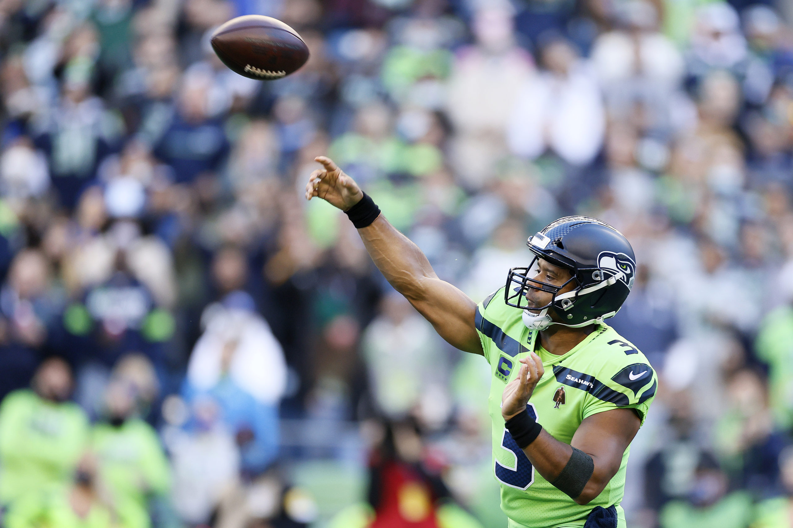 SEATTLE, WASHINGTON - OCTOBER 07: Quarterback Russell Wilson #3 of the Seattle Seahawks passes against the Los Angeles Rams in the first half at Lumen Field on October 07, 2021 in Seattle, Washington. Steph Chambers/Getty Images