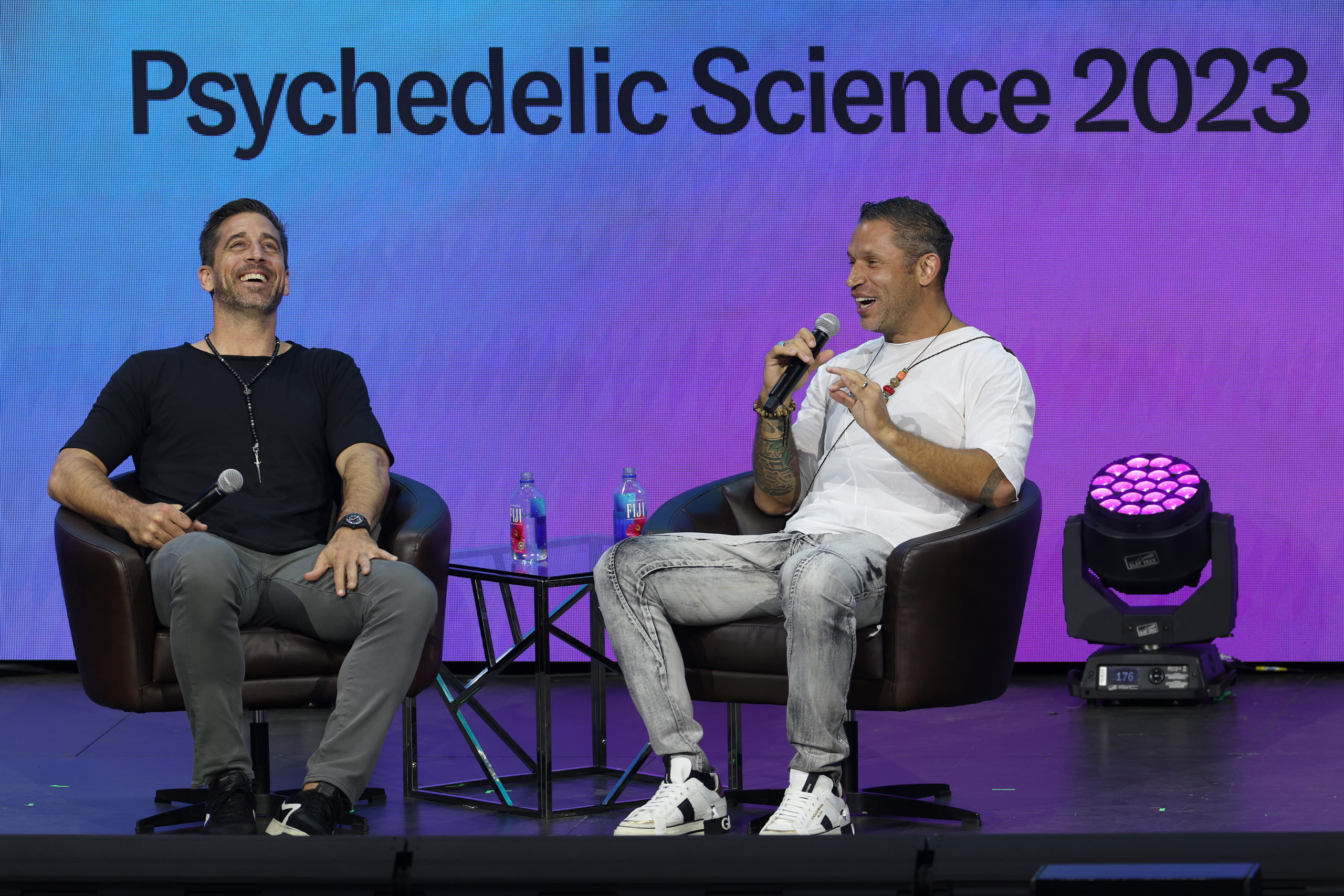 DENVER, COLORADO - JUNE 21: NFL Quarterback Aaron Rodgers participates in a talk with author Aubrey Marcus as part of Psychedelic Science 2023 in the Bellcor Theatre of the Colorado Convention Center on June 21, 2023 in Denver, Colorado. Matthew Stockman/Getty Images