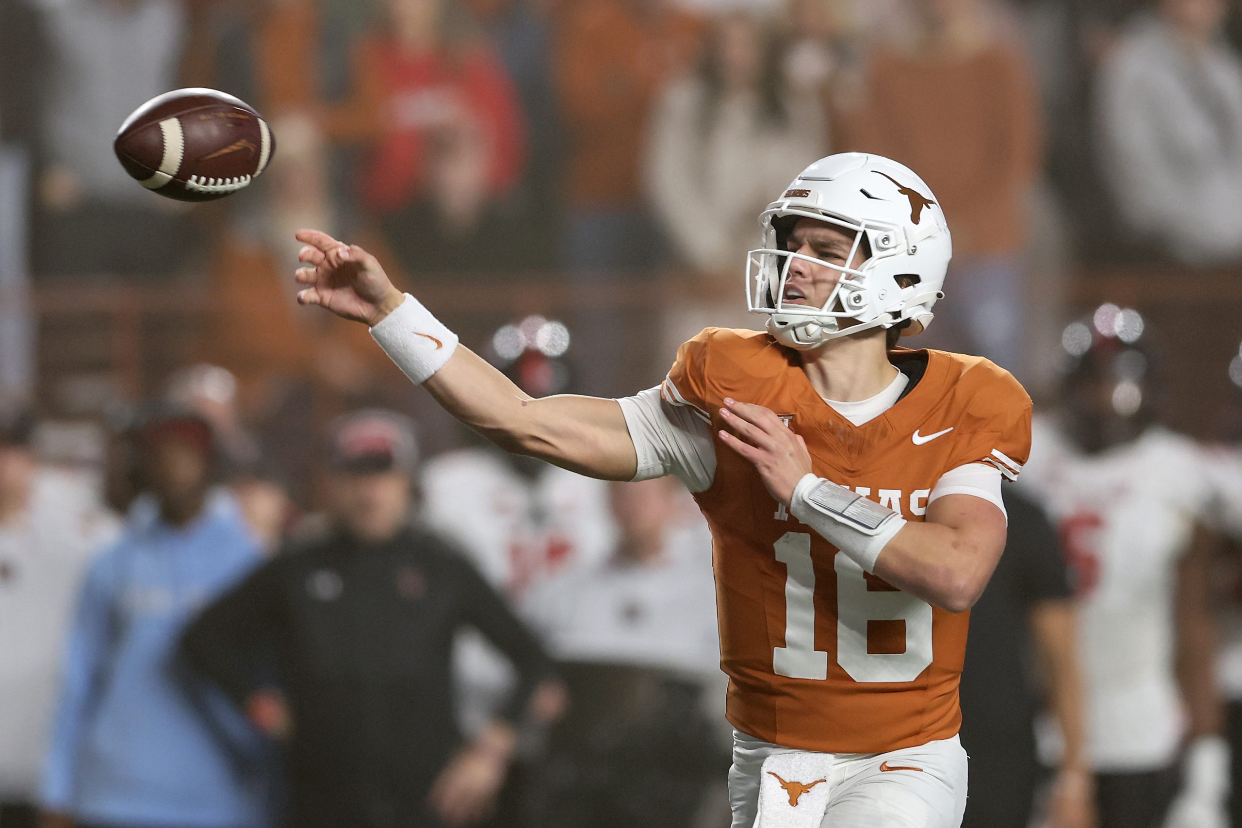 AUSTIN, TEXAS - NOVEMBER 24: Arch Manning #16 of the Texas Longhorns throws a pass in the fourth quarter against the Texas Tech Red Raiders at Darrell K Royal-Texas Memorial Stadium on November 24, 2023 in Austin, Texas. Tim Warner/Getty Images
