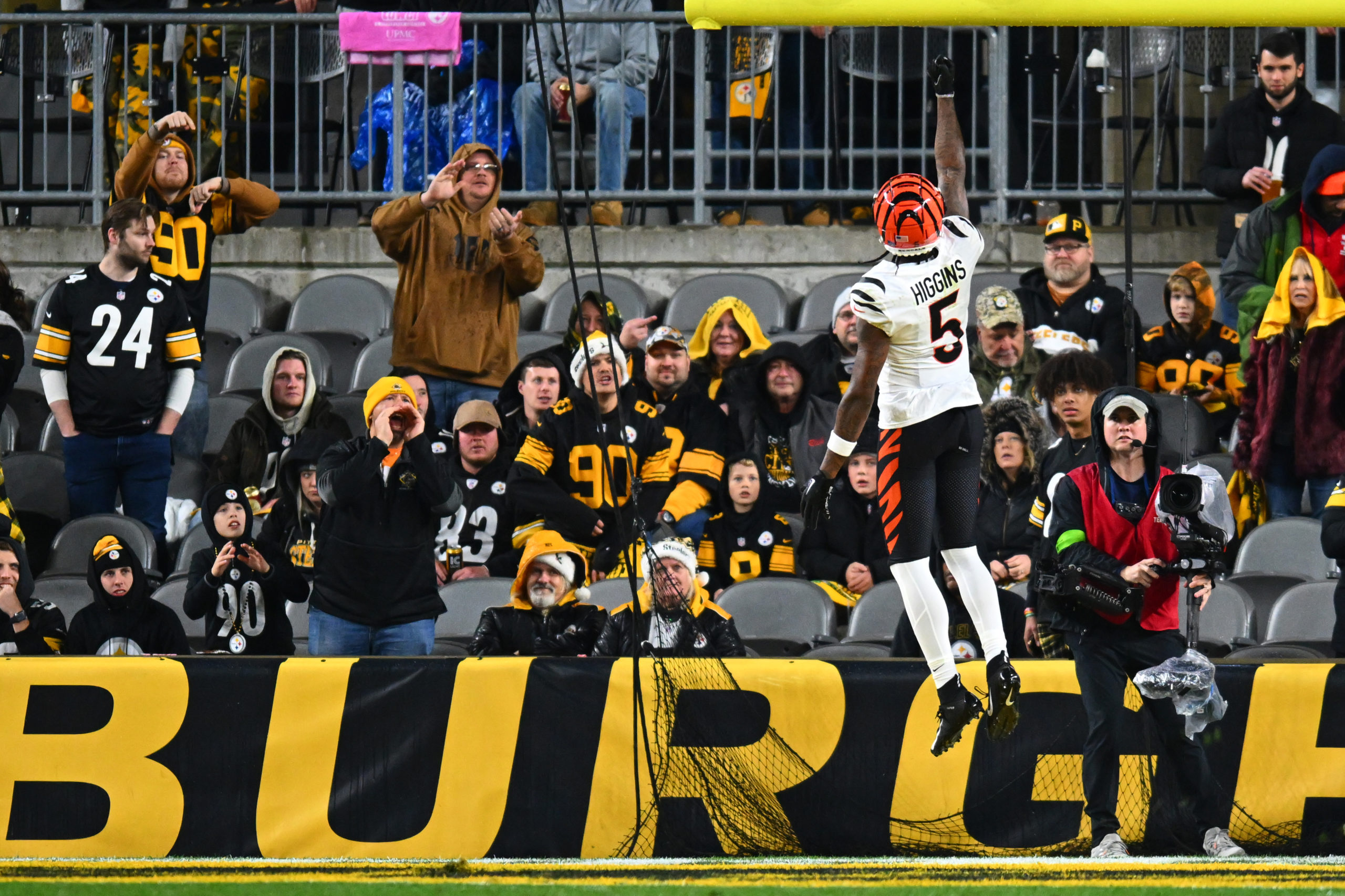 PITTSBURGH, PENNSYLVANIA - DECEMBER 23: Tee Higgins #5 of the Cincinnati Bengals celebrates after scoring a touchdown during the third quarter of a game against the Pittsburgh Steelers at Acrisure Stadium on December 23, 2023 in Pittsburgh, Pennsylvania. Joe Sargent/Getty Images