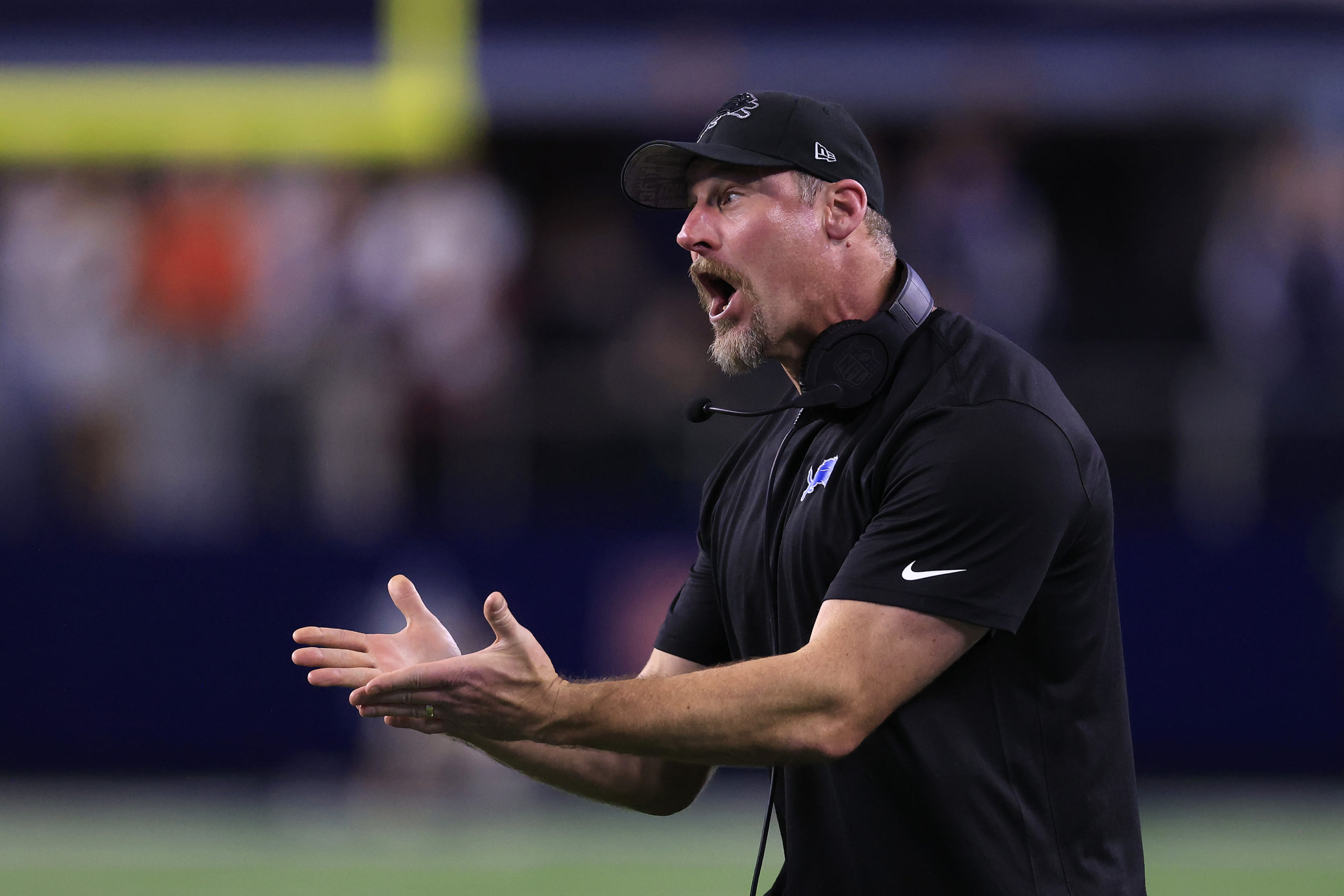 ARLINGTON, TEXAS - DECEMBER 30: Head coach Dan Campbell of the Detroit Lions reacts to a penalty during a two point conversion attempt against the Dallas Cowboys during the fourth quarter in the game at AT&T Stadium on December 30, 2023 in Arlington, Texas. Ron Jenkins/Getty Images