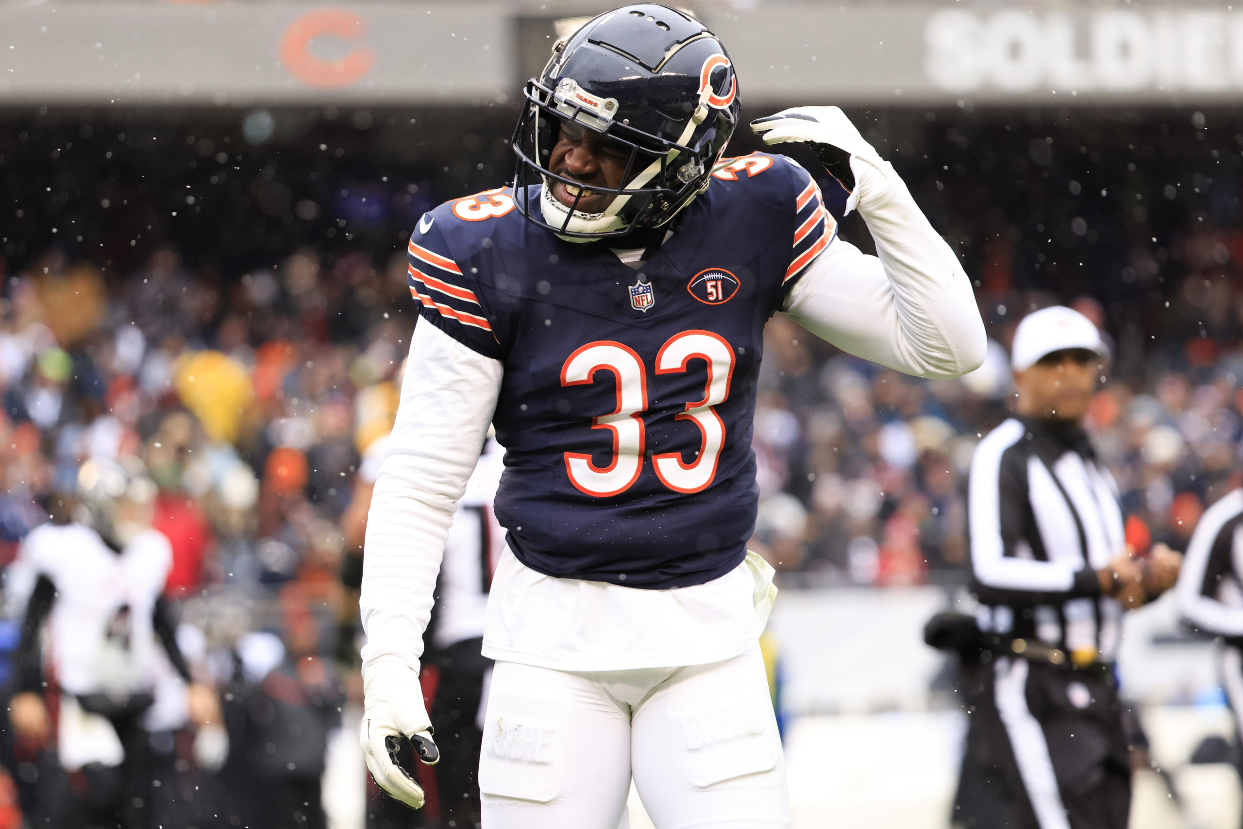 CHICAGO, ILLINOIS - DECEMBER 31: Jaylon Johnson #33 of the Chicago Bears reacts after a play during the first half against the Atlanta Falcons at Soldier Field on December 31, 2023 in Chicago, Illinois. Justin Casterline/Getty Images