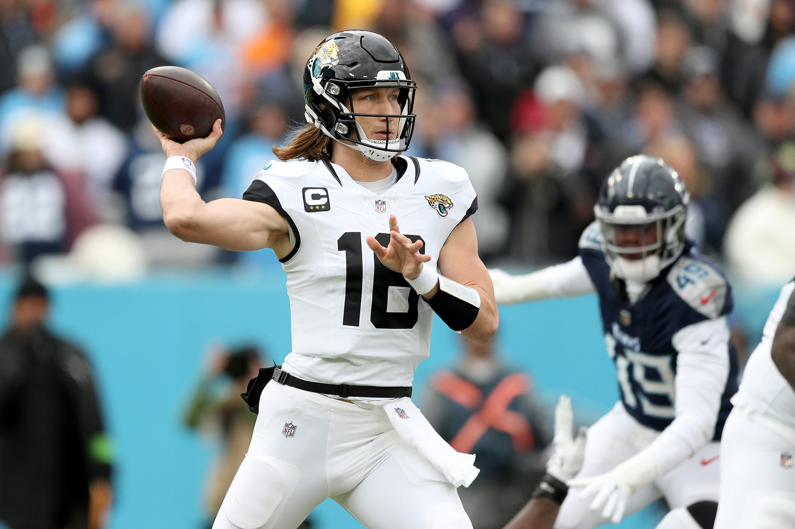 NASHVILLE, TENNESSEE - JANUARY 07: Trevor Lawrence #16 of the Jacksonville Jaguars throws a pass during the first half against the Tennessee Titans at Nissan Stadium on January 07, 2024 in Nashville, Tennessee. Justin Ford/Getty Images