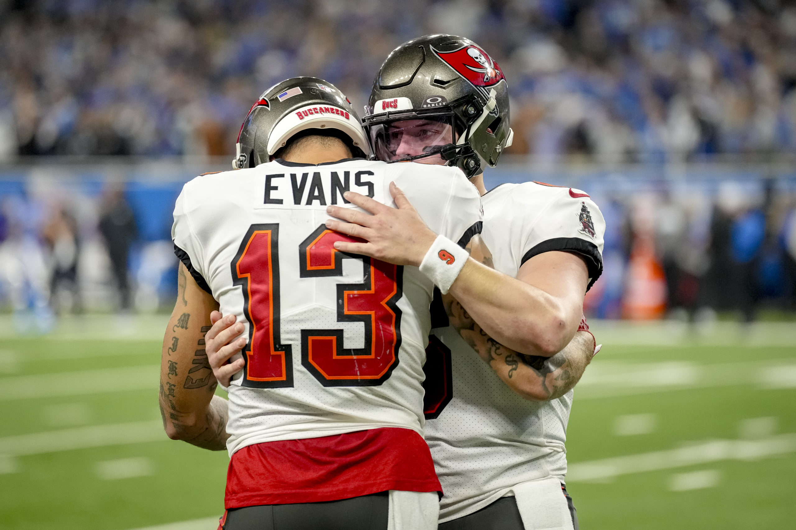 DETROIT, MICHIGAN - JANUARY 21: Baker Mayfield #6 of the Tampa Bay Buccaneers embraces Mike Evans #13 of the Tampa Bay Buccaneers after throwing an interception against the Detroit Lions during the fourth quarter of the NFC Divisional Playoff game at Ford Field on January 21, 2024 in Detroit, Michigan. Nic Antaya/Getty Images
