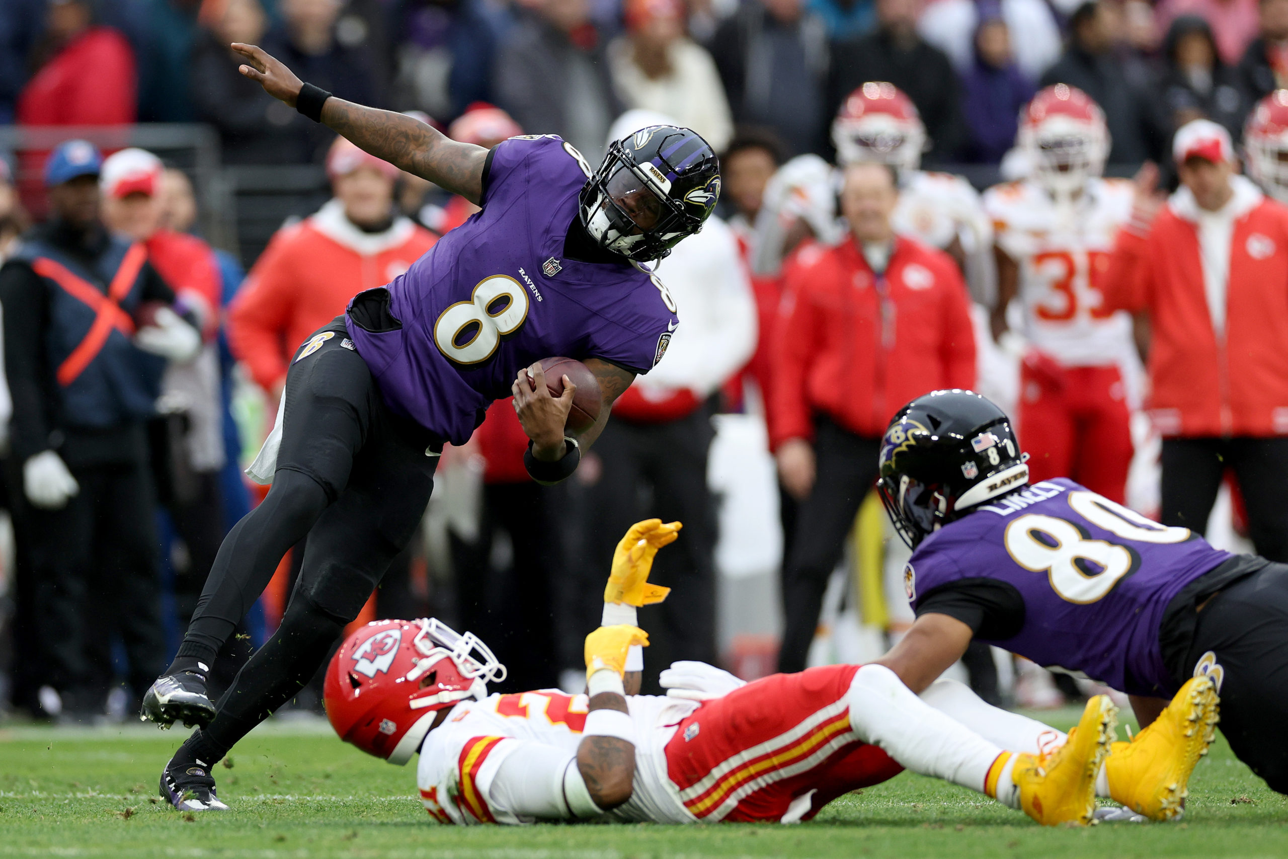 BALTIMORE, MARYLAND - JANUARY 28: Lamar Jackson #8 of the Baltimore Ravens runs with the ball against the Kansas City Chiefs during the second quarter in the AFC Championship Game at M&T Bank Stadium on January 28, 2024 in Baltimore, Maryland. Patrick Smith/Getty Images