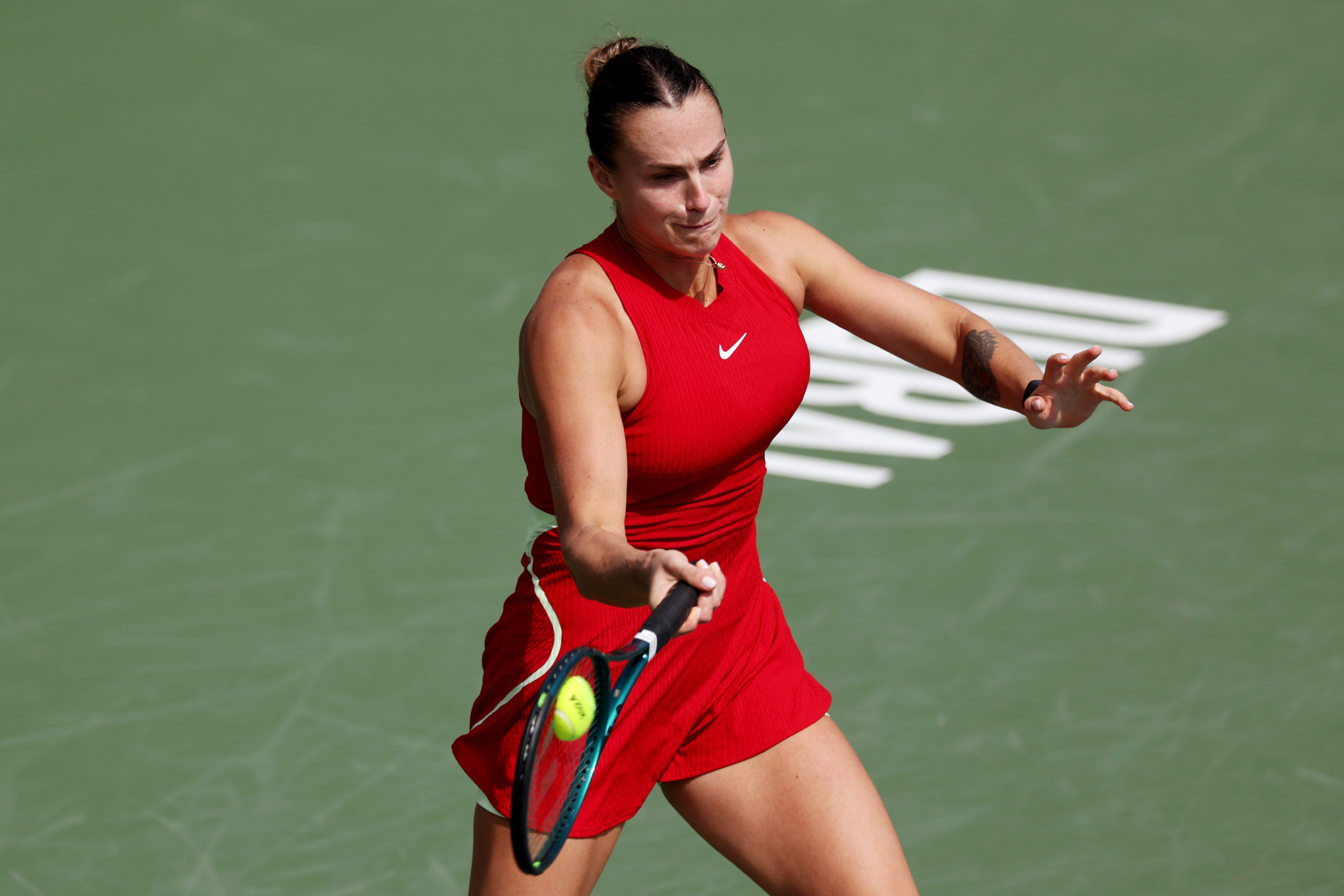 DUBAI, UNITED ARAB EMIRATES - FEBRUARY 20: Aryna Sabalenka plays a forehand against Donna Vekic of Croatia in their second round women's singles match during the Dubai Duty Free Tennis Championships, part of the Hologic WTA Tour at Dubai Duty Free Tennis Stadium on February 20, 2024 in Dubai, United Arab Emirates. Christopher Pike/Getty Images
