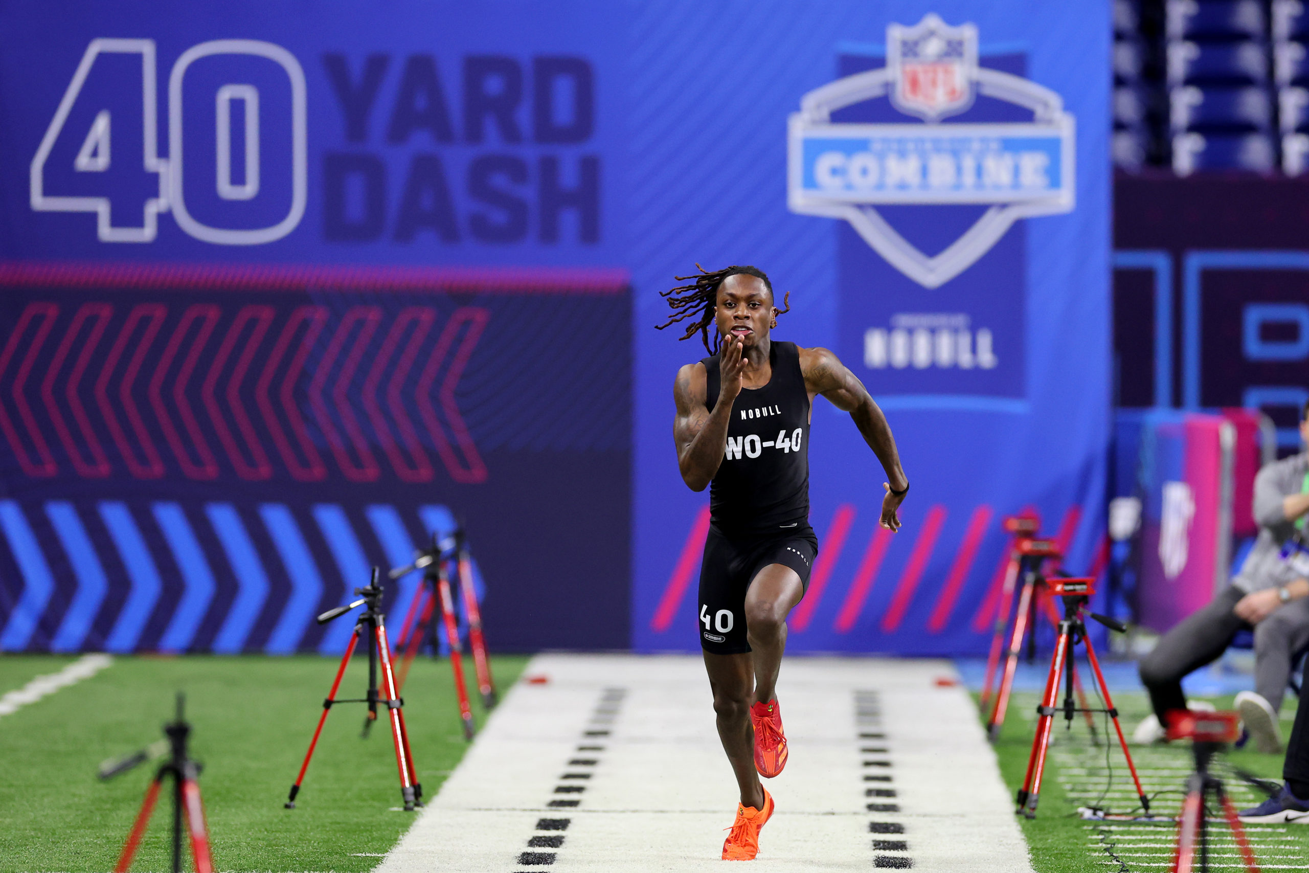 INDIANAPOLIS, INDIANA - MARCH 02: Xavier Worthy #WO40 of Texas participates in the 40-yard dash during the NFL Combine at Lucas Oil Stadium on March 02, 2024 in Indianapolis, Indiana. Stacy Revere/Getty Images
