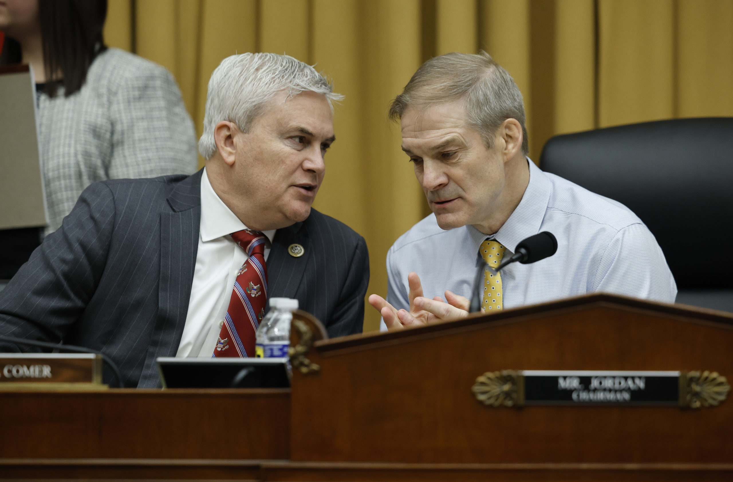 Rep. James Comer (R-KY) (L) talks to Chairman Rep. Jim Jordan (R-OH) as former Special Counsel Robert K. Hur testifies before the House Judiciary Committee on March 12, 2024 in Washington, DC. Hur investigated U.S. President Joe Biden’s mishandling of classified documents and published a final report with contentious conclusions about Biden’s memory. (Photo by Win McNamee/Getty Images)