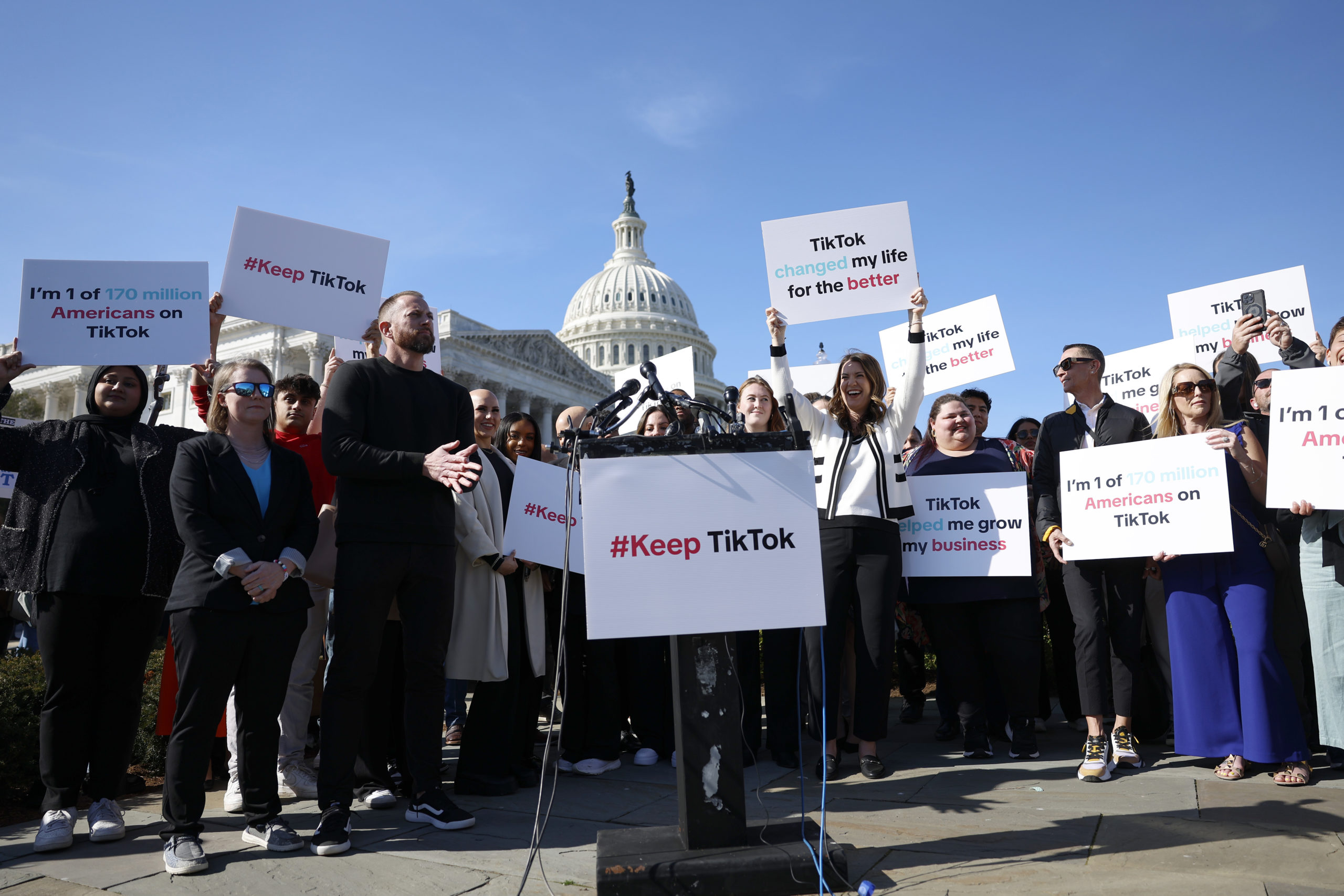 WASHINGTON, DC - MARCH 12: Participants hold up signs in support of TikTok at a news conference outside the U.S. Capitol Building on March 12, 2024 in Washington, DC. House Democrats and TikTok creators and business owners held the news conference to express their concern over House Republicans legislation that would force the owners of the popular Chinese social media app to sell the platform or face a ban in the United States. (Photo by Anna Moneymaker/Getty Images)