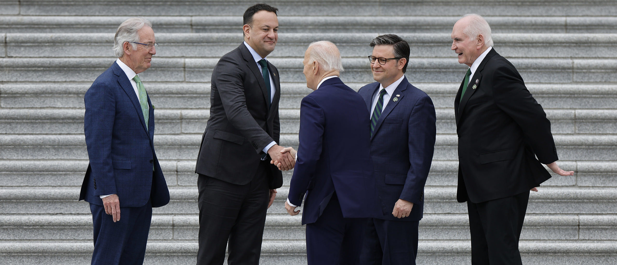 WASHINGTON, DC - MARCH 15: U.S. President Joe Biden (C) is greeted by (L-R) , Rep. Richard Neal (D-MA), Irish Taoiseach Leo Varadkar, Speaker of the House Mike Johnson (R-LA) and Rep. Mike Kelly (R-PA) as the president arrives at the U.S. Capitol on March 15, 2023 in Washington, DC. Biden joined Varadkar and members of Congress for the traditional St. Patrick's Day Friends of Ireland luncheon. The Friends of Ireland caucus was founded in 1981 by the late Irish-American politicians Sen. Ted Kennedy (D-MA), Sen. Daniel Moynihan (D-NY) and former Speaker of the House Tip O’Neill (D-MA) to help broker peace and reconciliation in Northern Ireland. (Photo by Chip Somodevilla/Getty Images)