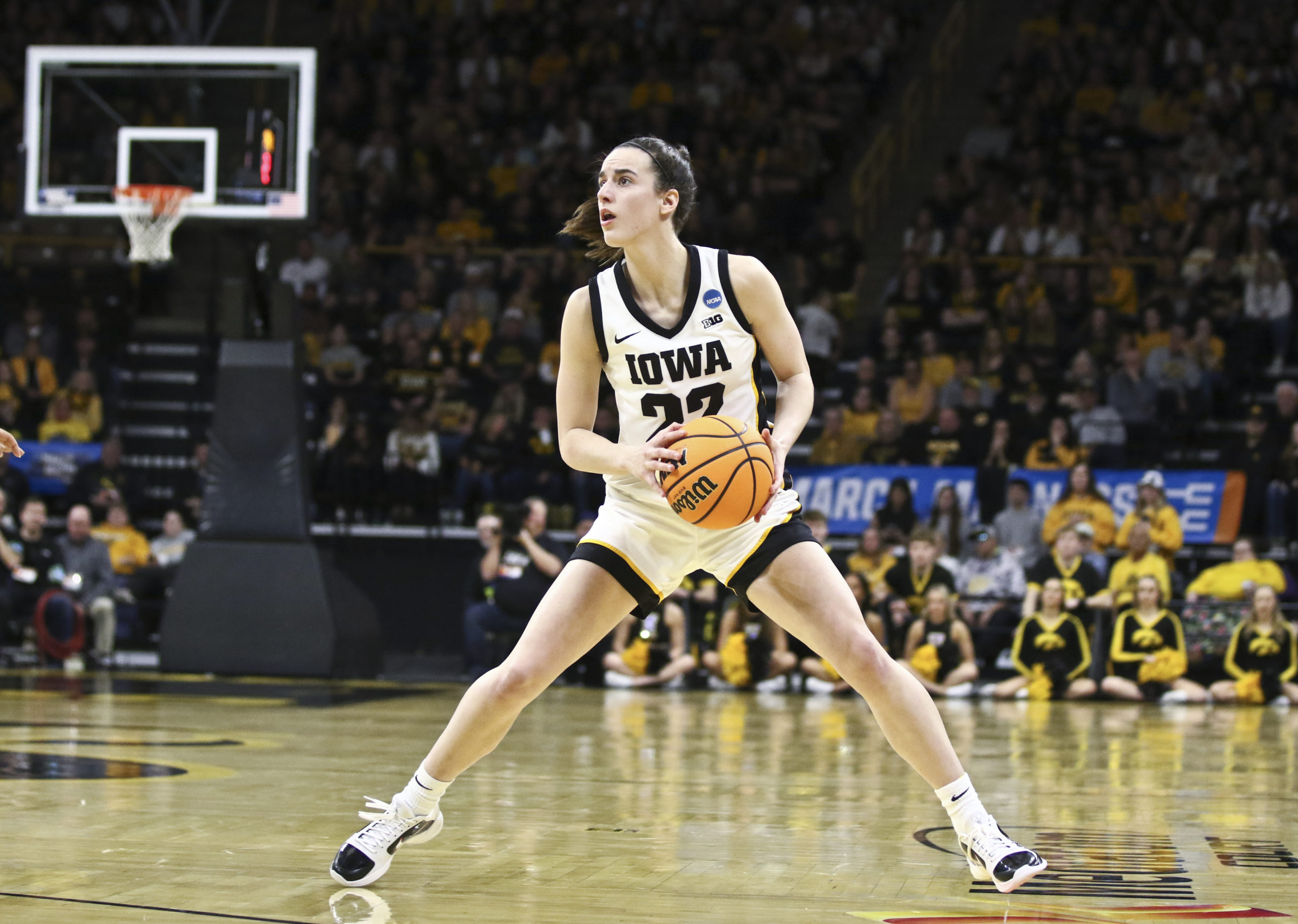 IOWA CITY, IOWA- MARCH 23: Guard Caitlin Clark #22 of the Iowa Hawkeyes leaps into 3-point range for a shot in the first half against the Holy Cross Crusaders during their match-up in the 2024 NCAA Division 1 Womens Basketball Championship at Carver-Hawkeye Arena on March 23, 2024 in Iowa City, Iowa. Matthew Holst/Getty Images