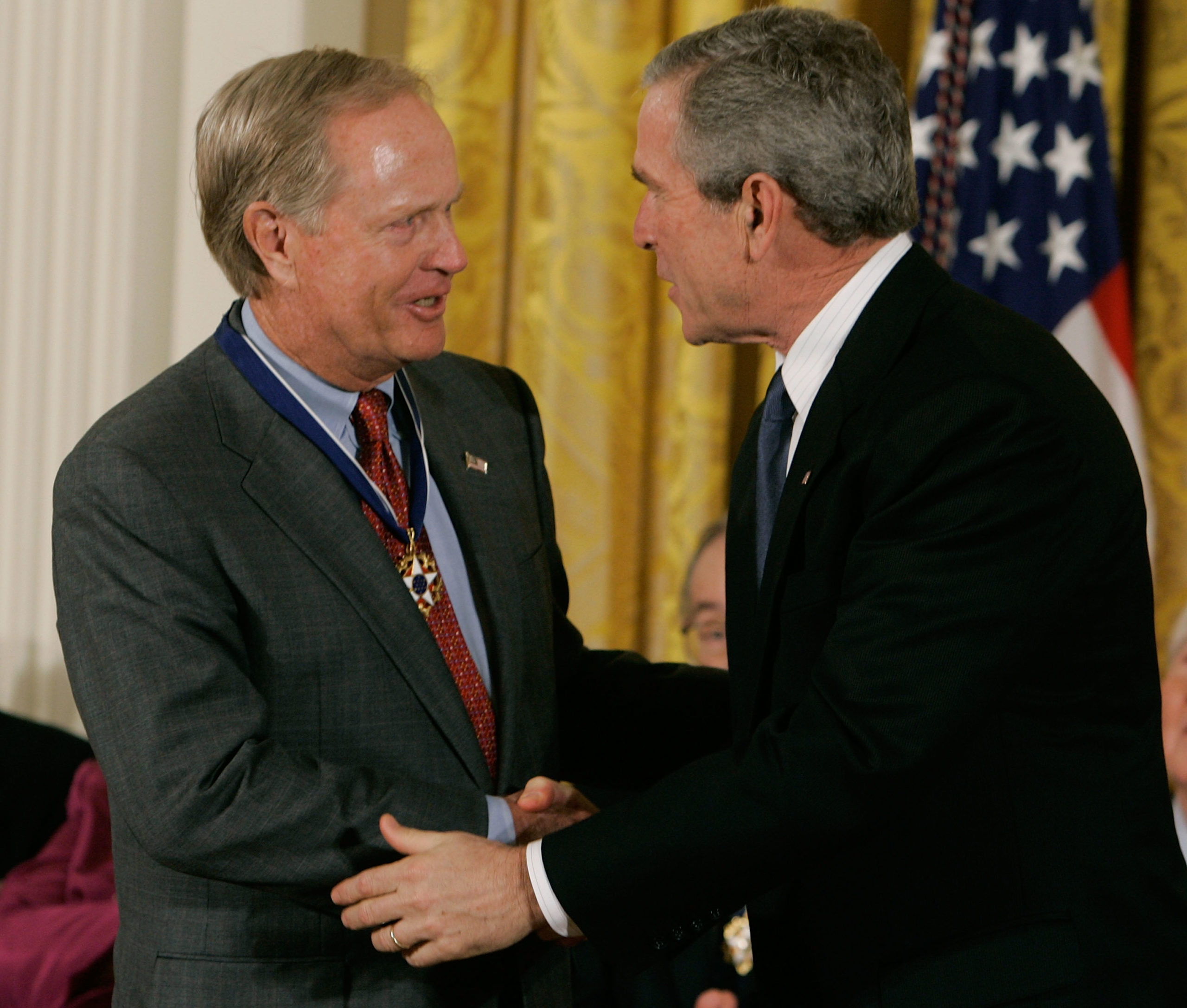 WASHINGTON - NOVEMBER 09: U.S. President George W. Bush (R) congratulates golfing great Jack Nicklaus after presenting him with the Medal of Freedom during a ceremony at the White House November 9, 2005 in Washington DC. President Bush presented medals to the 2005 Medal of Freedom recipients during a ceremony in the East Room. Mark Wilson/Getty Images