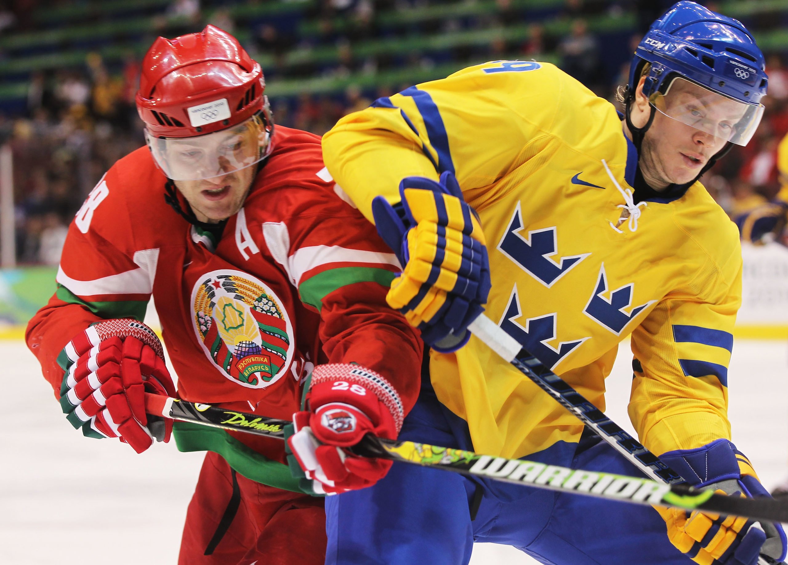 VANCOUVER, BC - FEBRUARY 19: Konstantin Koltsov #28 of Belarus challenges Tobias Enstrom #39 of Sweden for the puck during the ice hockey men's preliminary game on day 8 of the Vancouver 2010 Winter Olympics at Canada Hockey Place on February 19, 2010 in Vancouver, Canada. Jamie Squire/Getty Images