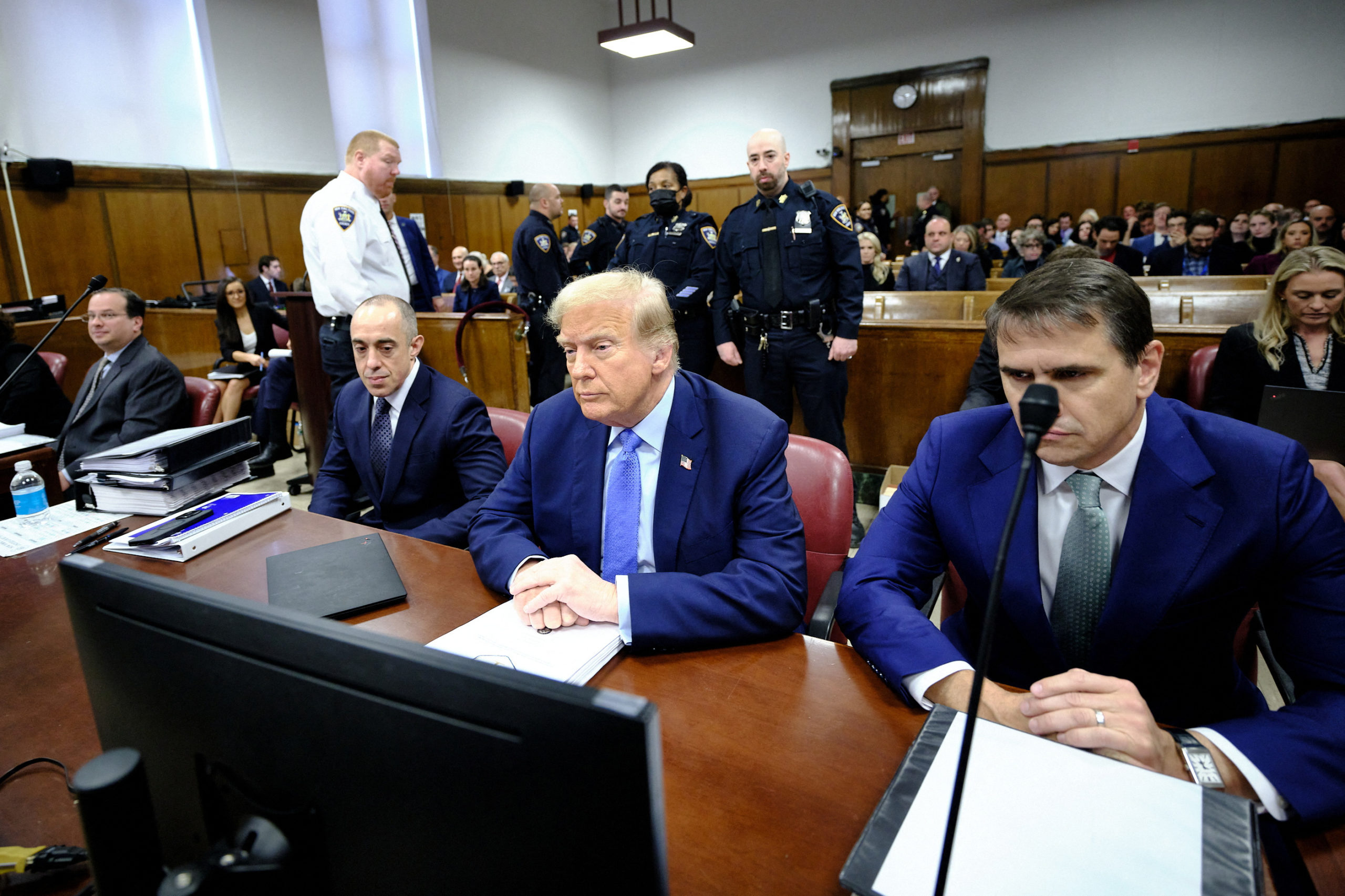Former U.S. President Donald Trump sits in the courtroom at Manhattan criminal court in New York, U.S., on Friday, April 26, 2024. Trump faces 34 felony counts of falsifying business records as part of an alleged scheme to silence claims of extramarital sexual encounters during his 2016 presidential campaign. Curtis Means/Pool via REUTERS