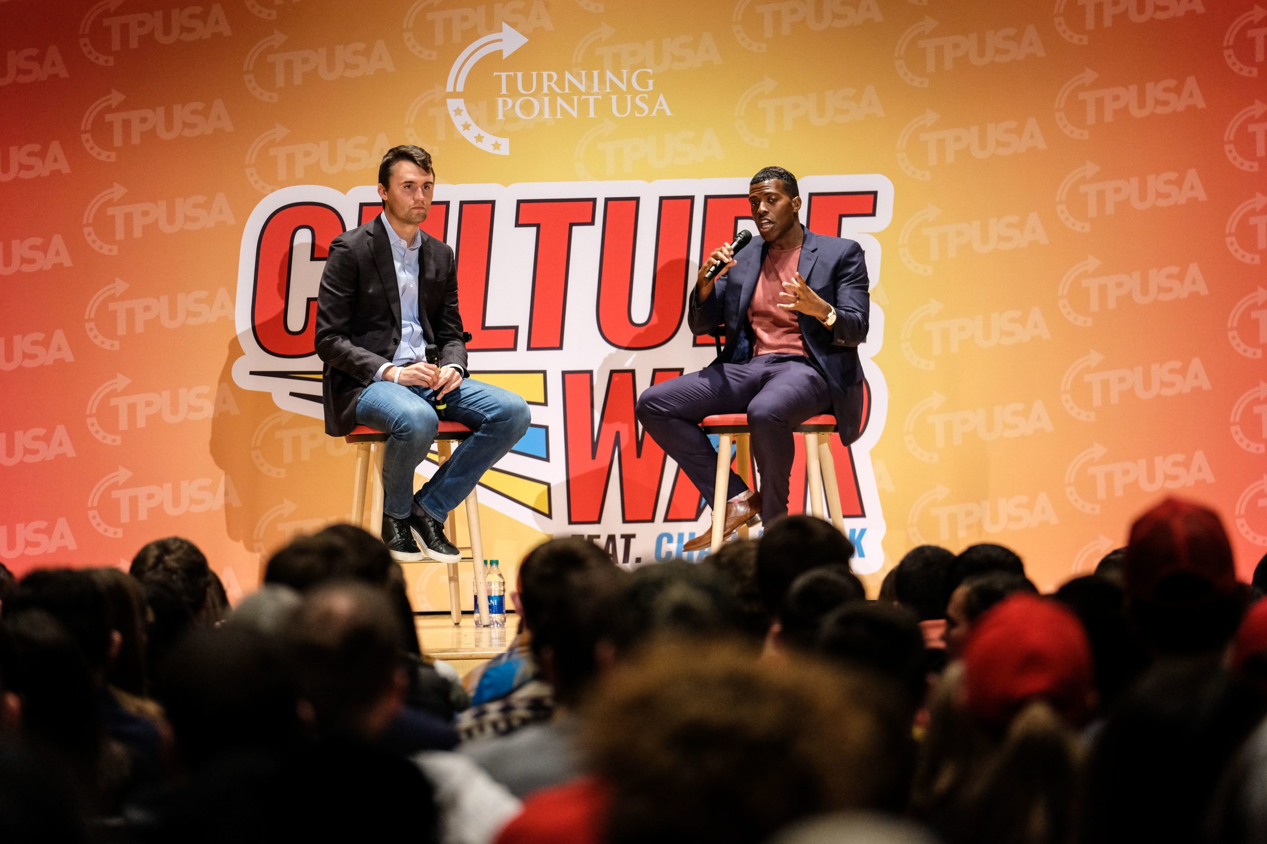 Charlie Kirk and Rob Smith speak at Turning Point USA (TPUSA) Culture War event at the Ohio State University in Columbus, Ohio on October 29, 2019. The organizations mission is to identify, educate, train, and organize students to promote conservative principles. - They like his straightforward speaking style, his policies on immigration and the economic boom achieved during his administration. They are still teenagers, or just past 20. In a year from now, they will vote in their first presidential election in key swing state Ohio -- and they're giving Donald Trump their support. (Photo by Megan JELINGER / AFP) (Photo by MEGAN JELINGER/AFP via Getty Images)