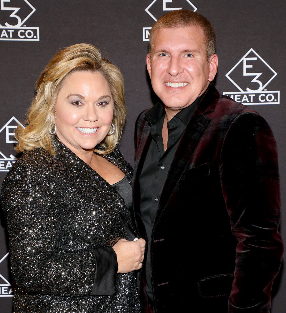 NASHVILLE, TENNESSEE - NOVEMBER 20: Julie Chrisley (L) and Todd Chrisley attend the grand opening of E3 Chophouse Nashville on November 20, 2019 in Nashville, Tennessee. (Photo by Danielle Del Valle/Getty Images for E3 Chophouse Nashville)