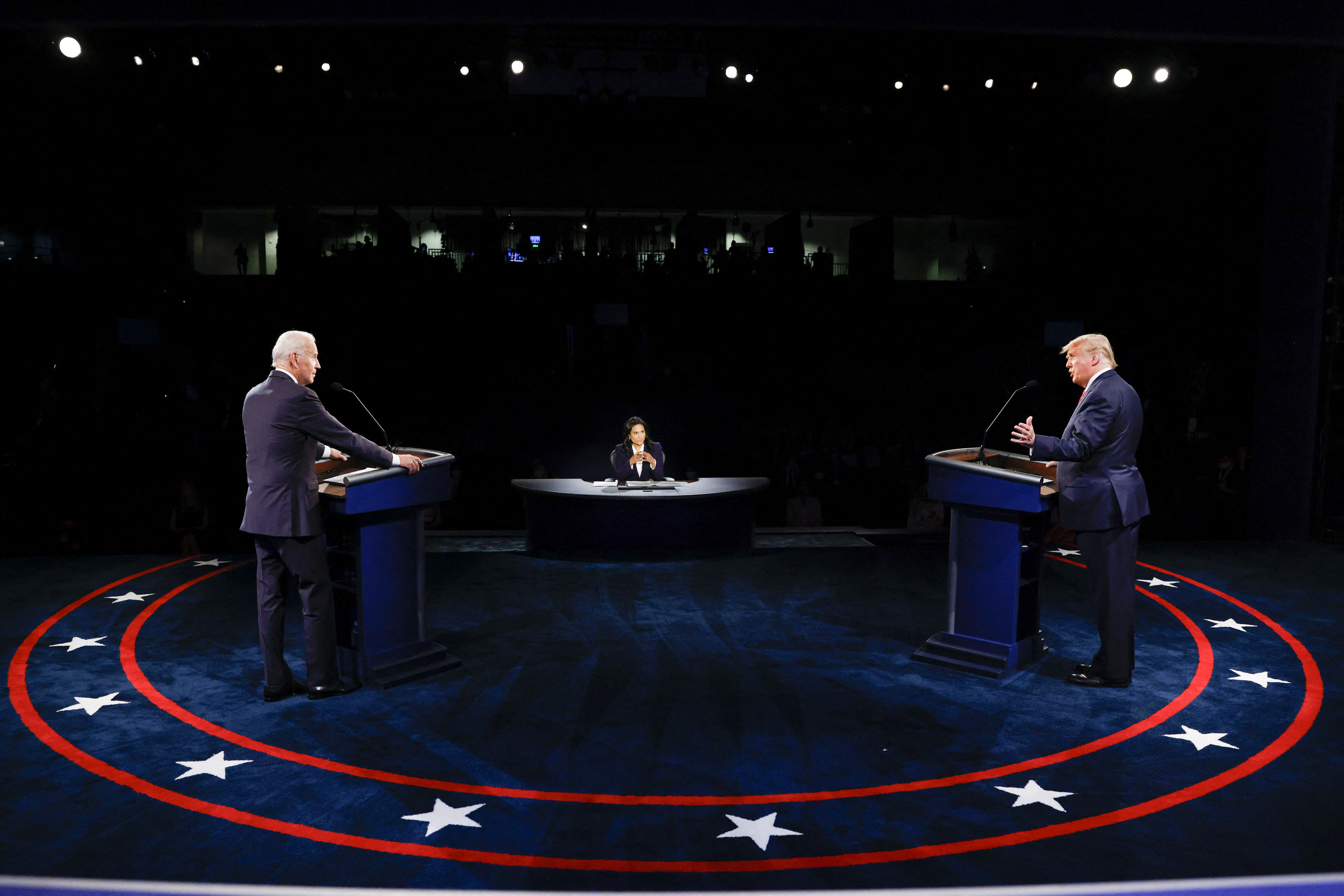 US President Donald Trump (R) Democratic Presidential candidate, former US Vice President Joe Biden and moderator, NBC News anchor, Kristen Welker (C) participate in the final presidential debate at Belmont University in Nashville, Tennessee, on October 22, 2020. (Photo by JIM BOURG / POOL / AFP) (Photo by JIM BOURG/POOL/AFP via Getty Images)