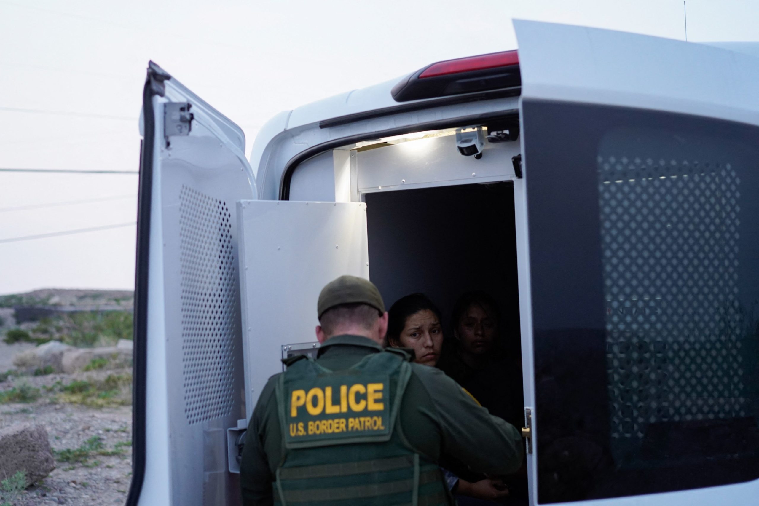 A woman who was apprehended crossing the US-Mexico border, in Sunland Park, New Mexico on July 22, 2021. (Photo by PAUL RATJE/AFP via Getty Images)