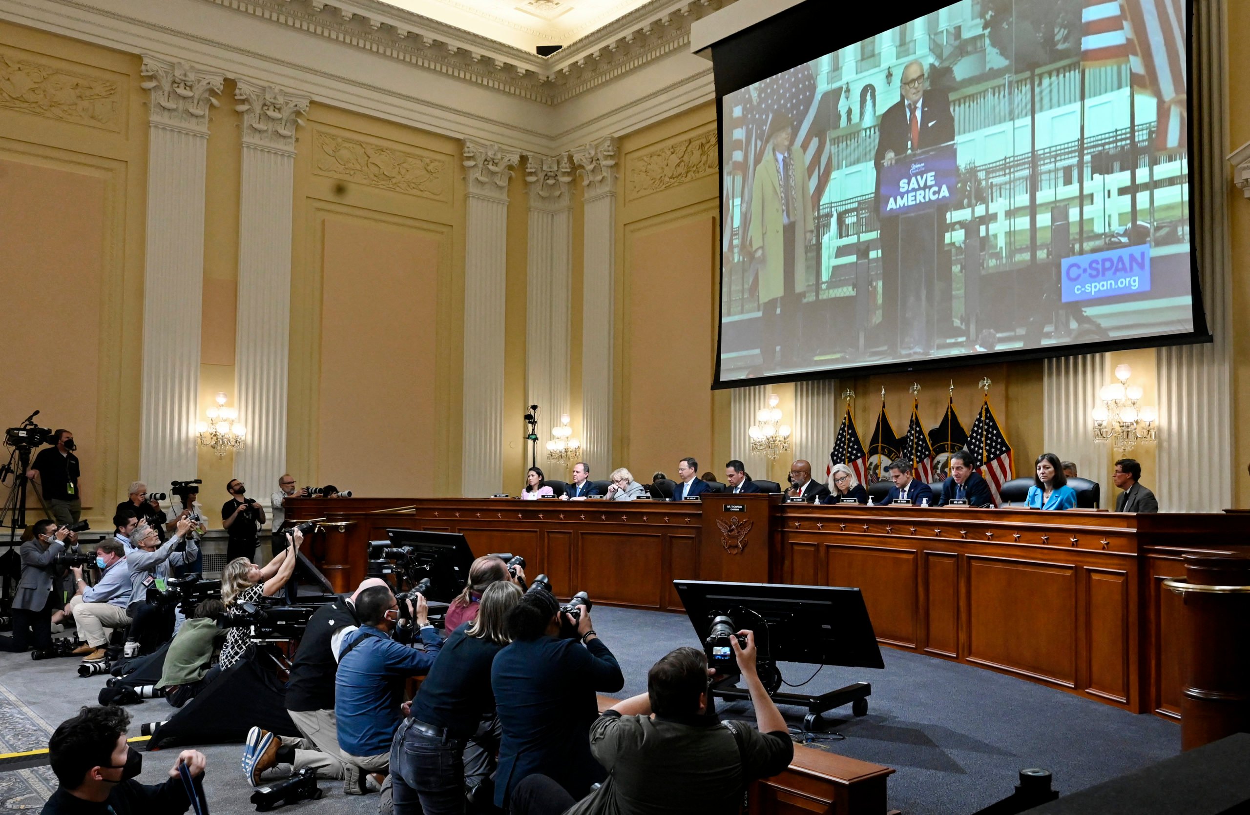 A video of John Eastman (L) and Rudy Giuliani (R) is projected as the US House Select Committee to Investigate the January 6 Attack on the US Capitol holds its third public hearing, on Capitol Hill in Washington, DC, on June 16, 2022. (Photo by OLIVIER DOULIERY / AFP) (Photo by OLIVIER DOULIERY/AFP via Getty Images)