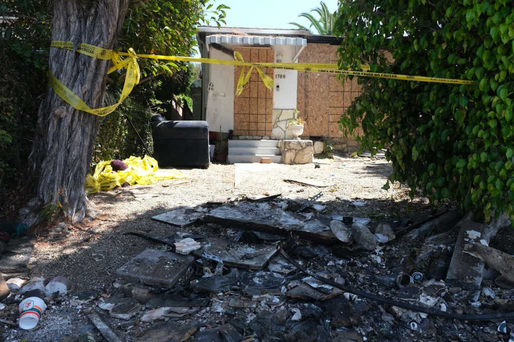 Charred debris and caution tape are seen at the site where US actress Anne Heche crashed into a home in Mar Vista, California on August 8, 2022. - US actress Anne Heche has been hospitalized in critical condition after crashing her car into a Los Angeles home, US media reported on August 5, 2022. The 53-year-old actress initially crashed into an apartment building garage before driving off, according to images collected by TMZ. (Photo by Chris Delmas / AFP) (Photo by CHRIS DELMAS/AFP via Getty Images)