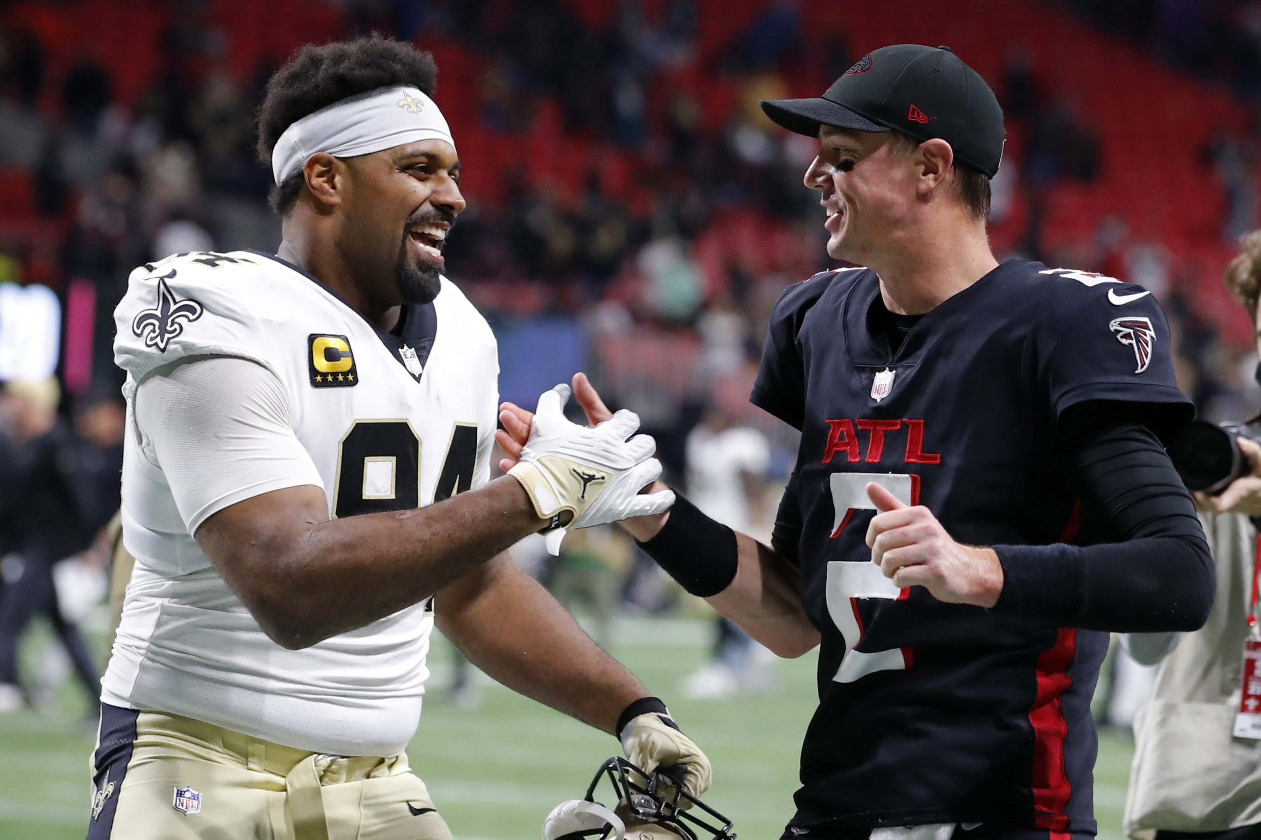 ATLANTA, GEORGIA - JANUARY 09: Matt Ryan #2 of the Atlanta Falcons talks with Cameron Jordan #94 of the New Orleans Saints after the game at Mercedes-Benz Stadium on January 09, 2022 in Atlanta, Georgia. Todd Kirkland/Getty Images
