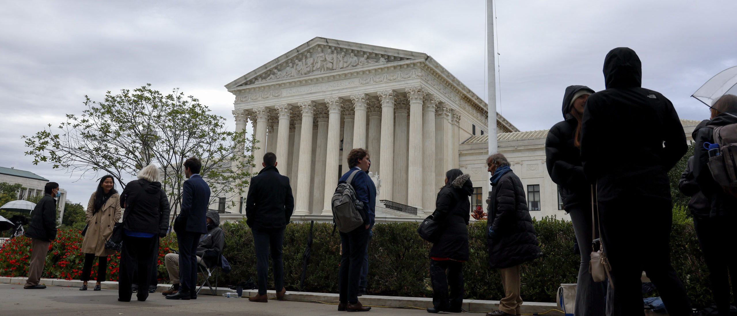 People wait in line outside the U.S. Supreme Court Building to hear oral arguments on October 03, 2022 in Washington, DC. (Photo by Anna Moneymaker/Getty Images)