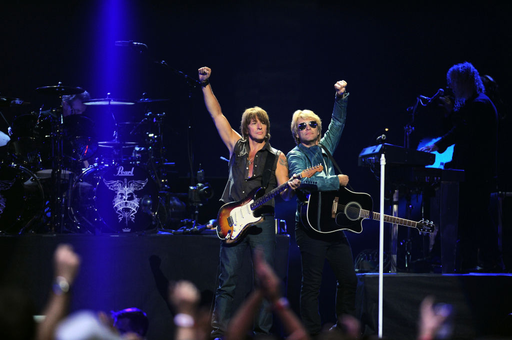 LAS VEGAS, NV - SEPTEMBER 21: Guitarist Richie Sambora (L) and singer Jon Bon Jovi of Bon Jovi perform onstage during the 2012 iHeartRadio Music Festival at the MGM Grand Garden Arena on September 21, 2012 in Las Vegas, Nevada. (Photo by Isaac Brekken/Getty Images for Clear Channel)