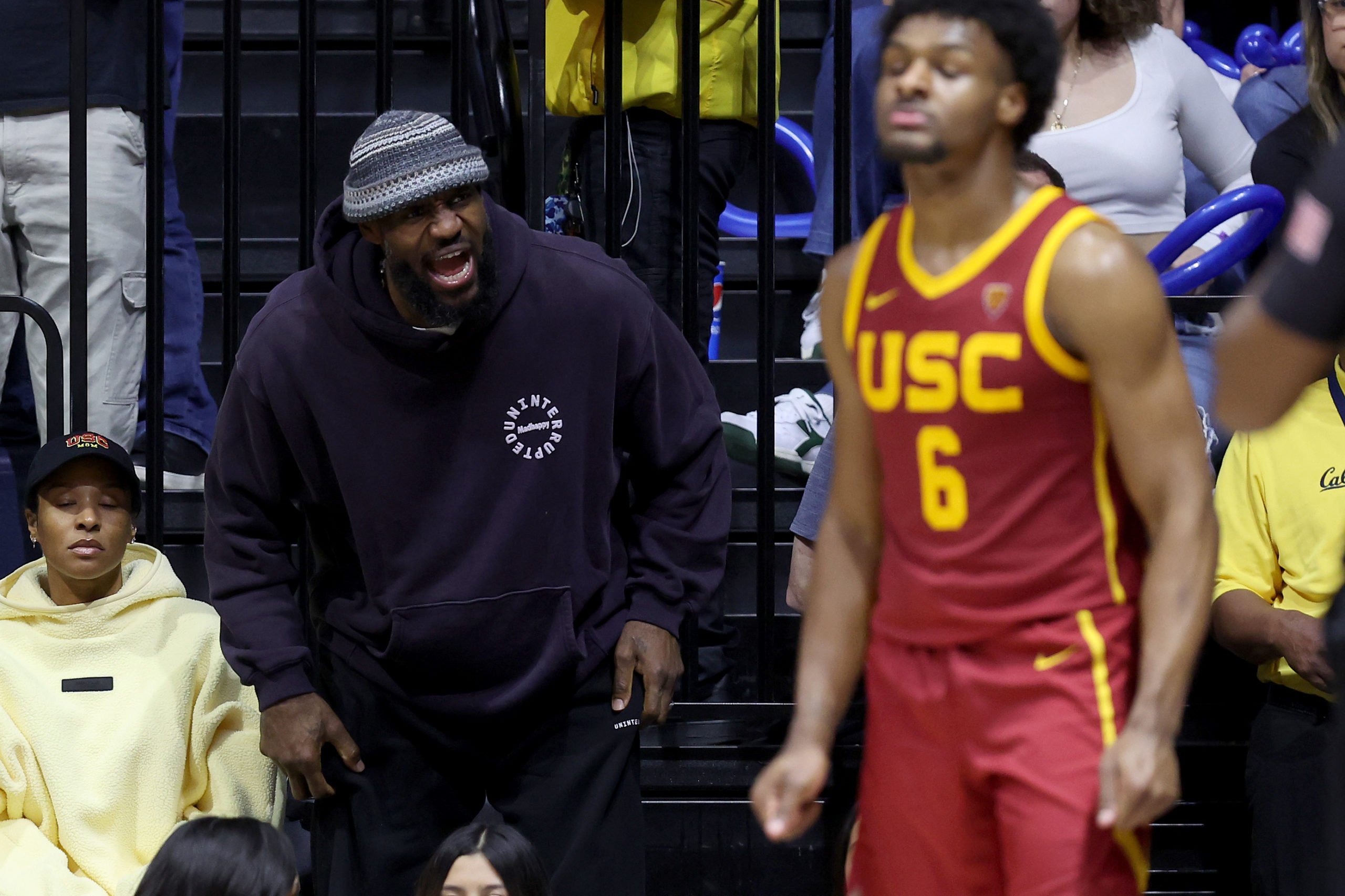 BERKELEY, CALIFORNIA - FEBRUARY 07: LeBron James #23 of the Los Angeles Lakers shouts to his son, Bronny James #6 of the USC Trojans, during Bronny's game against the California Golden Bears at Haas Pavilion on February 07, 2024 in Berkeley, California. Ezra Shaw/Getty Images