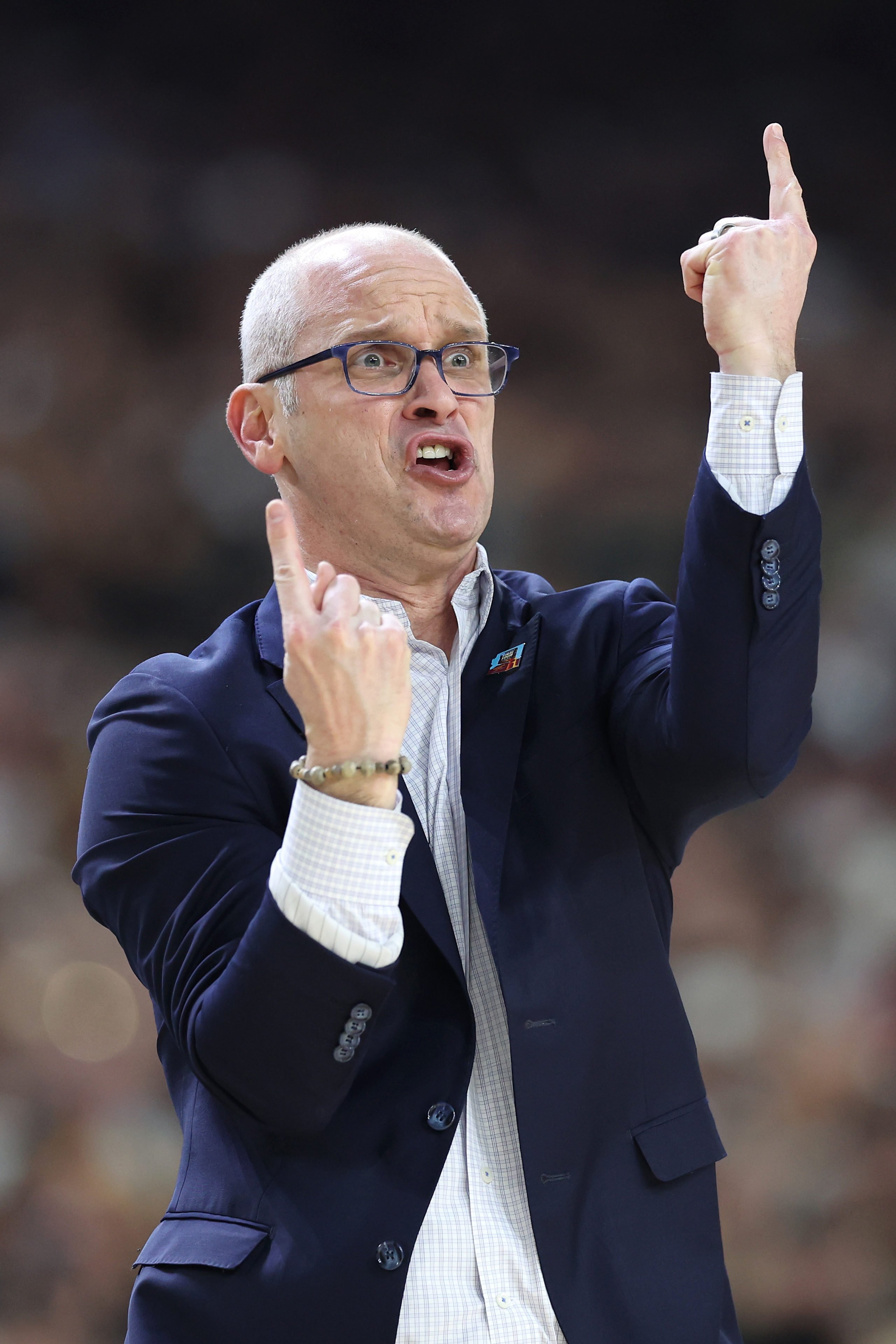 GLENDALE, ARIZONA - APRIL 08: Head coach Dan Hurley of the Connecticut Huskies calls out instructions in the first half against the Purdue Boilermakers during the NCAA Men's Basketball Tournament National Championship game at State Farm Stadium on April 08, 2024 in Glendale, Arizona. Christian Petersen/Getty Images