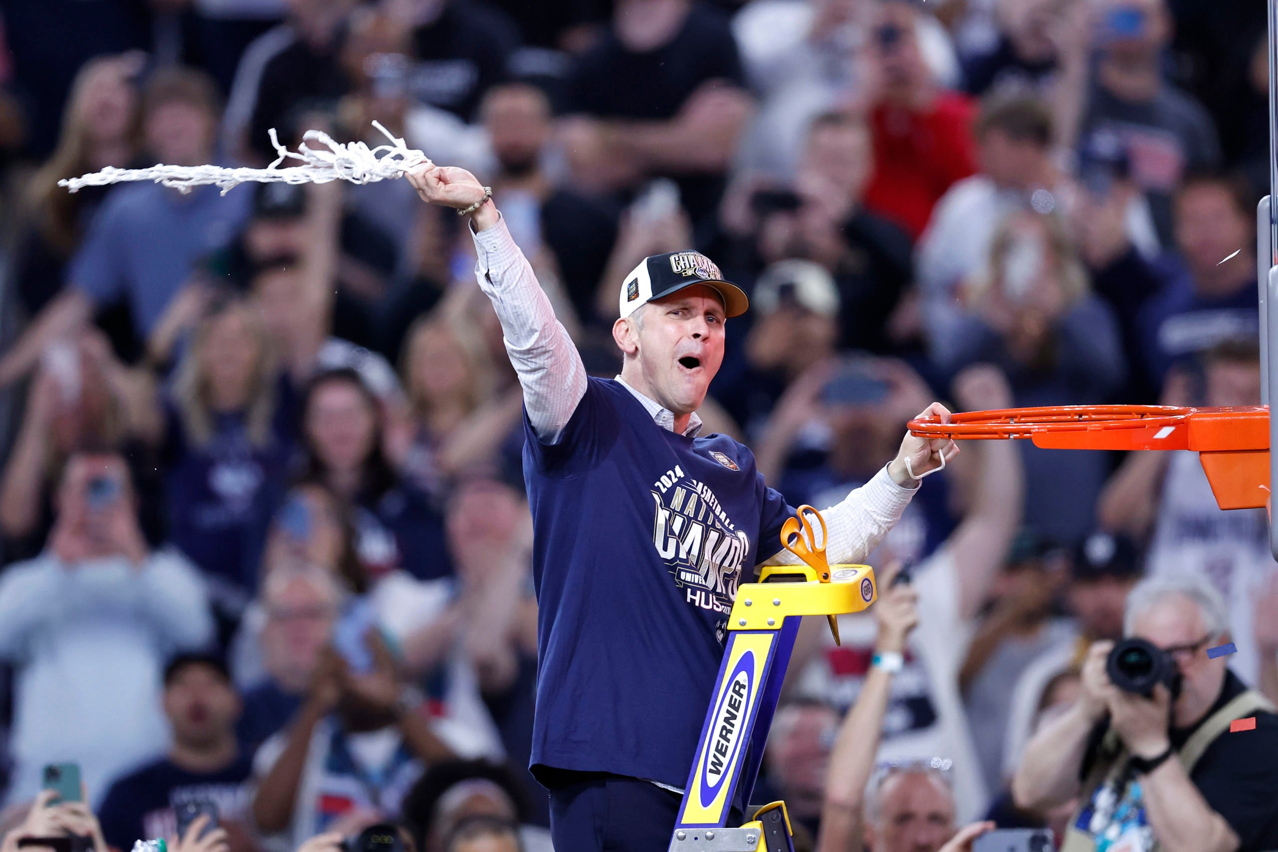 GLENDALE, ARIZONA - APRIL 08: Head coach Dan Hurley of the Connecticut Huskies cuts down the net after beating the Purdue Boilermakers 75-60 to win the NCAA Men's Basketball Tournament National Championship game at State Farm Stadium on April 08, 2024 in Glendale, Arizona. Chris Coduto/Getty Images