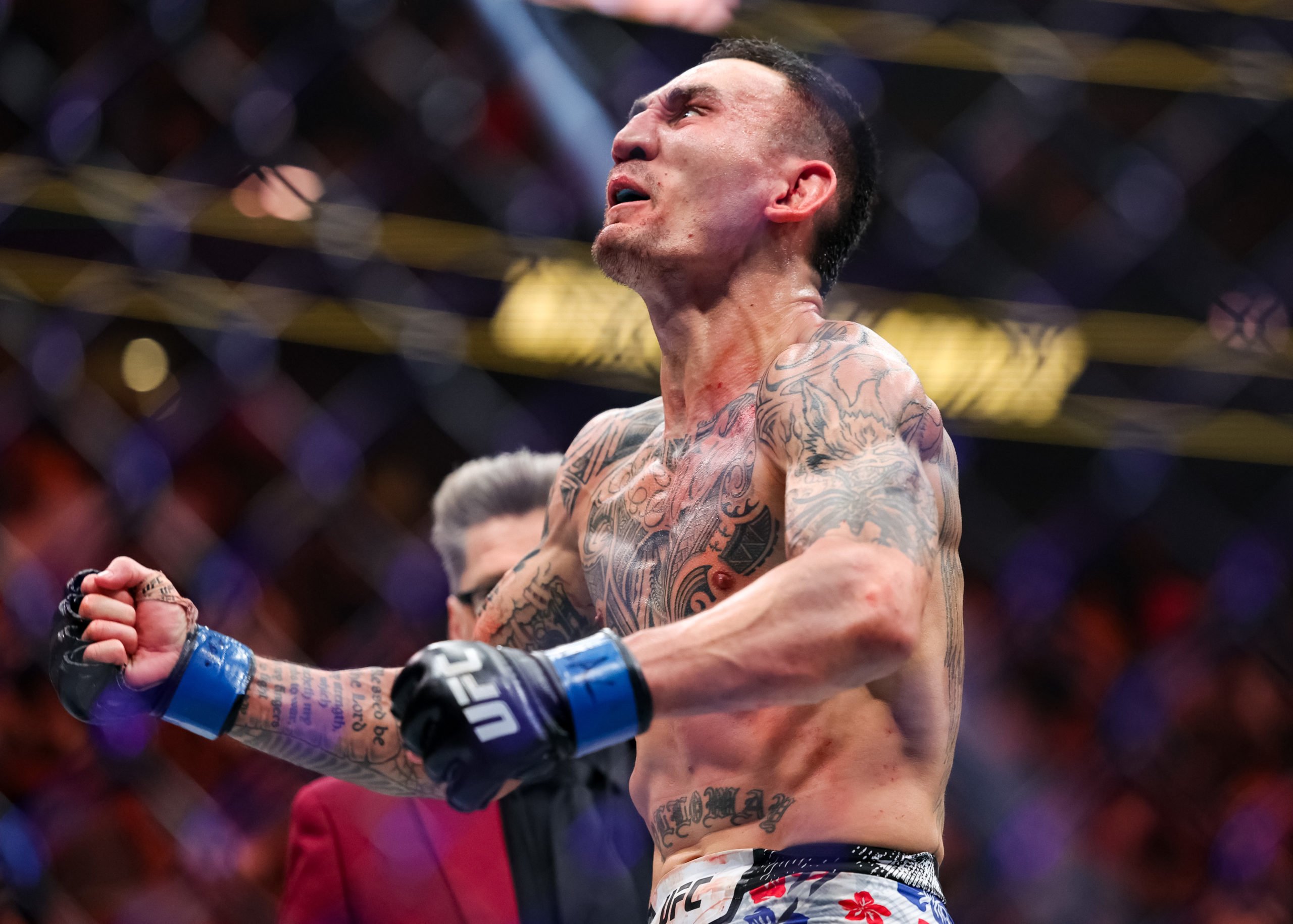 LAS VEGAS, NEVADA - APRIL 13: Max Holloway reacts to defating Justin Gaethje in their BMF title fight at T-Mobile Arena on April 13, 2024 in Las Vegas, Nevada. Carmen Mandato/Getty Images
