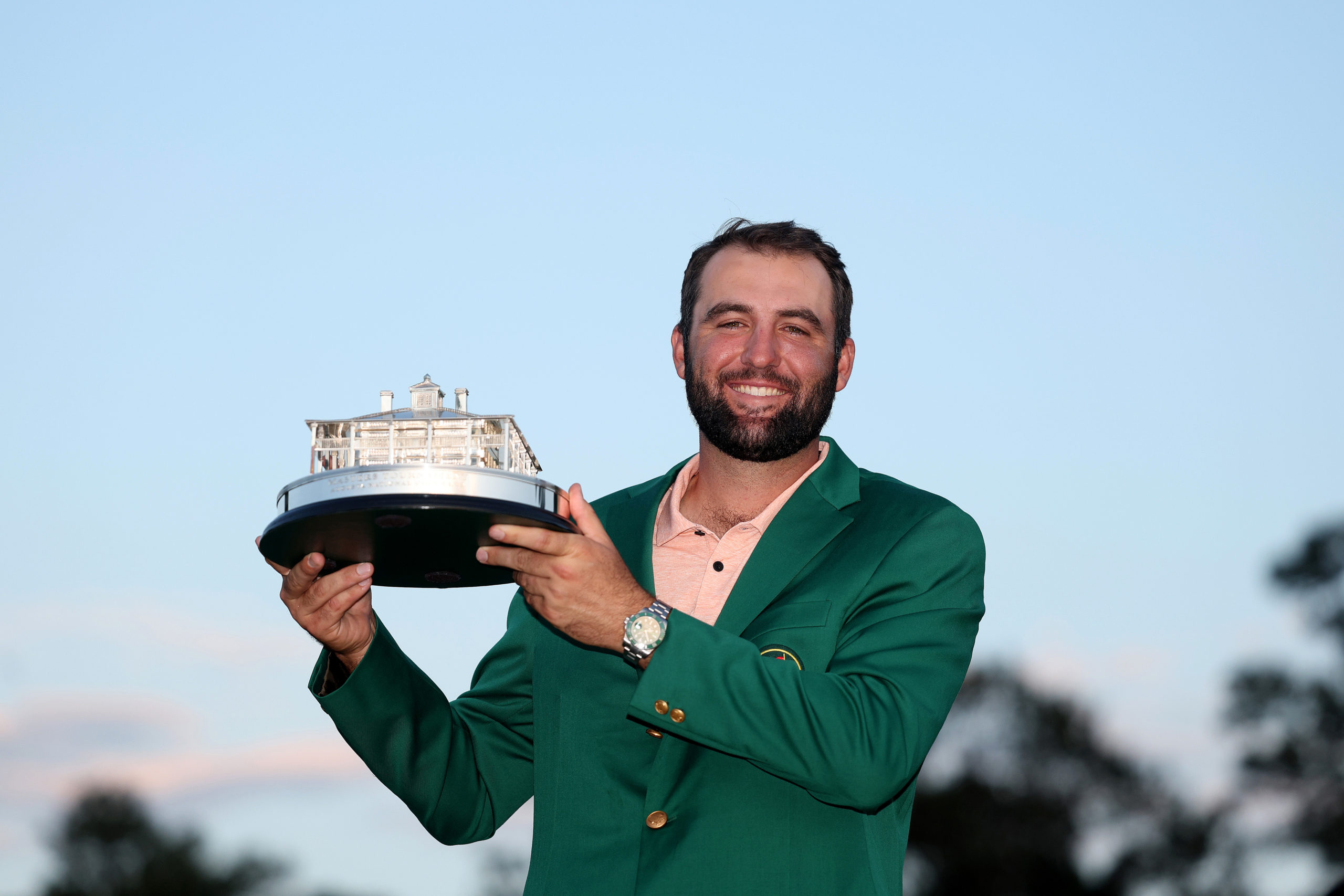AUGUSTA, GEORGIA - APRIL 14: Scottie Scheffler of the United States poses with the Masters trophy after winning the 2024 Masters Tournament at Augusta National Golf Club on April 14, 2024 in Augusta, Georgia. Warren Little/Getty Images