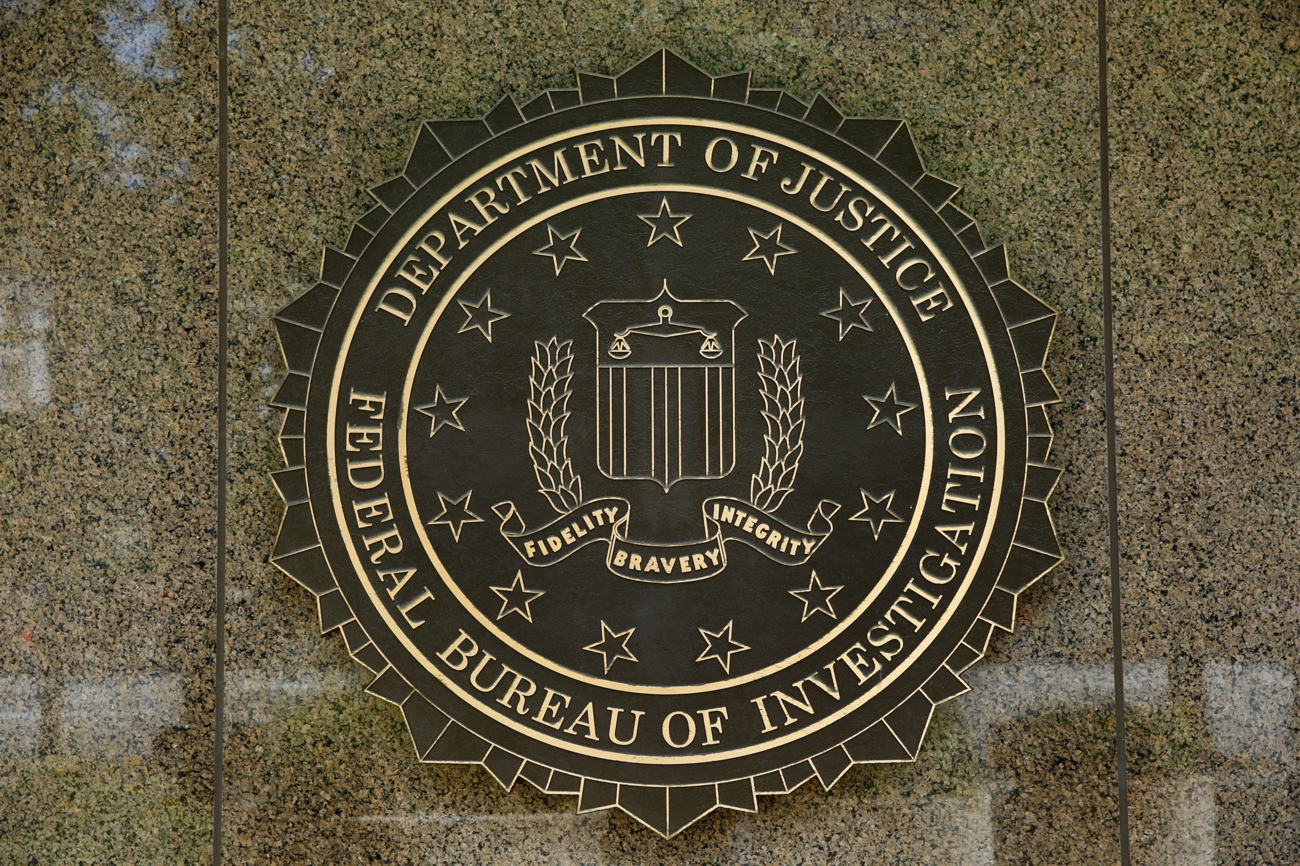 The FBI seal is seen outside the headquarters building in Washington, DC on July 5, 2016. - The FBI said Tuesday it will not recommend charges over Hillary Clinton's use of a private email server as secretary of state, but said she had been "extremely careless" in her handling of top secret data. The decision not to recommend prosecution will come as a huge relief for the presumptive Democratic nominee whose White House campaign has been dogged by the months-long probe. (Photo credit YURI GRIPAS/AFP via Getty Images)