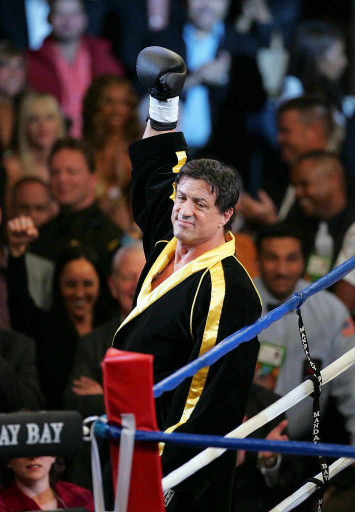 LAS VEGAS - DECEMBER 03: Actor Sylvester Stallone waves to the crowd as scenes from the film "Rocky VI" are filmed before the start of the Bernard Hopkins and Jermain Taylor fight at the Mandalay Bay Events Center on December 3, 2005 in Las Vegas, Nevada. (Photo by Ethan Miller/Getty Images)