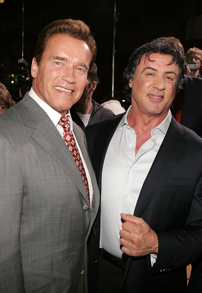 HOLLYWOOD - DECEMBER 13: California governor Arnold Schwarzenegger and actor/writer/director Sylvester Stallone arrive at the premiere of MGM's "Rocky Balboa" at the Grauman's Chinese Theater on December 13, 2006 in Hollywood, California. (Photo by Frazer Harrison/Getty Images)
