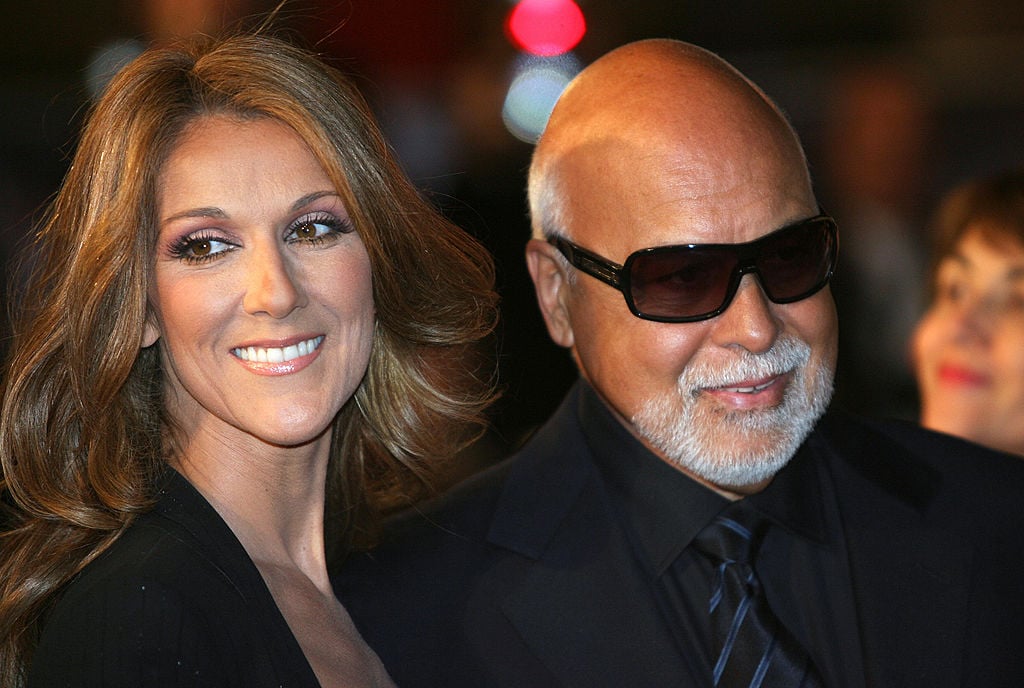 Canadian singer Celine Dion and husband Rene Angelil pose upon arrival at the Palais des Festivals in Cannes, southern France, 26 January 2008 to attend the 2008 NRJ Music Awards. AFP PHOTO VALERY HACHE (Photo credit should read VALERY HACHE/AFP via Getty Images)
