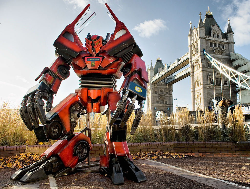 LONDON, ENGLAND - NOVEMBER 28: A British inspired Transformer, made from original bus parts is displayed in front of Tower Bridge on November 28, 2009 in London, England. Twitter fans voted to see a London 'bendy' bus made into a Transformer to celebrate the DVD & Blu-ray release of 'Transformers: Revenge of The Fallen' (Photo by Marco Secchi/Getty Images for Paramount Home Entertainment)