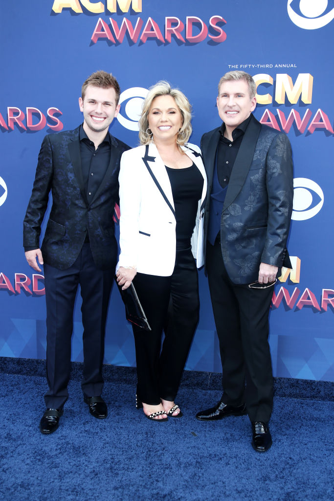 LAS VEGAS, NV - APRIL 15: (L-R) Chase Chrisley, Julie Chrisley, and Todd Chrisley attend the 53rd Academy of Country Music Awards at MGM Grand Garden Arena on April 15, 2018 in Las Vegas, Nevada (Photo by Tommaso Boddi/Getty Images)