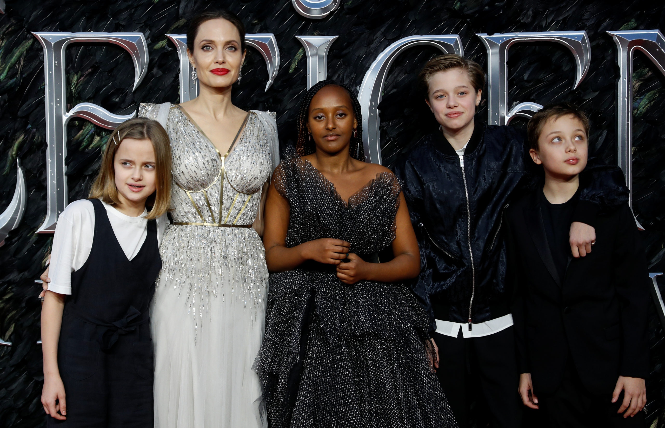 Actor Angelina Jolie, accompanied by her kids, poses as she attends the UK premiere of "Maleficent: Mistress of Evil" in London, Britain October 9, 2019. REUTERS/Peter Nicholls