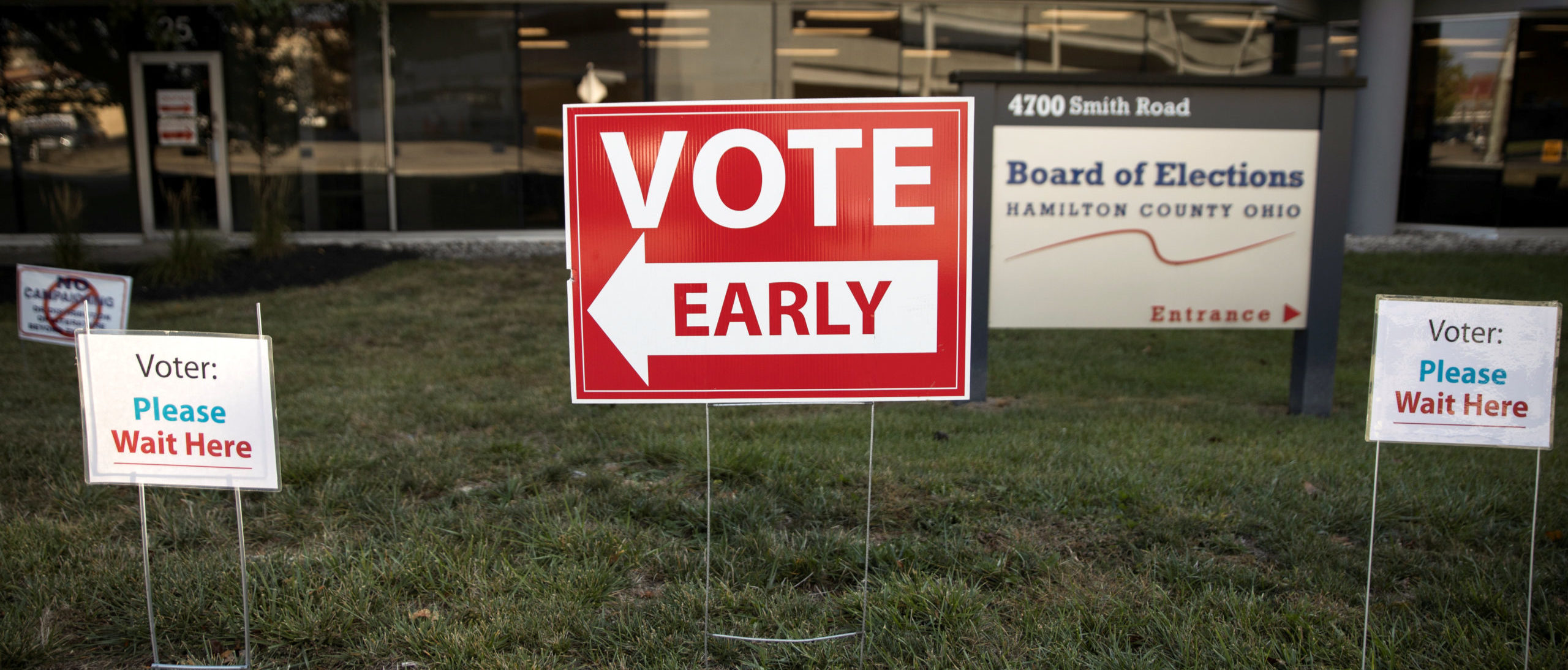 Early voting signs are placed outside of the Hamilton County Board of Elections building for the upcoming presidential election, as early voting begins in Cincinnati, Ohio, U.S., October 6, 2020. REUTERS/Megan Jelinger